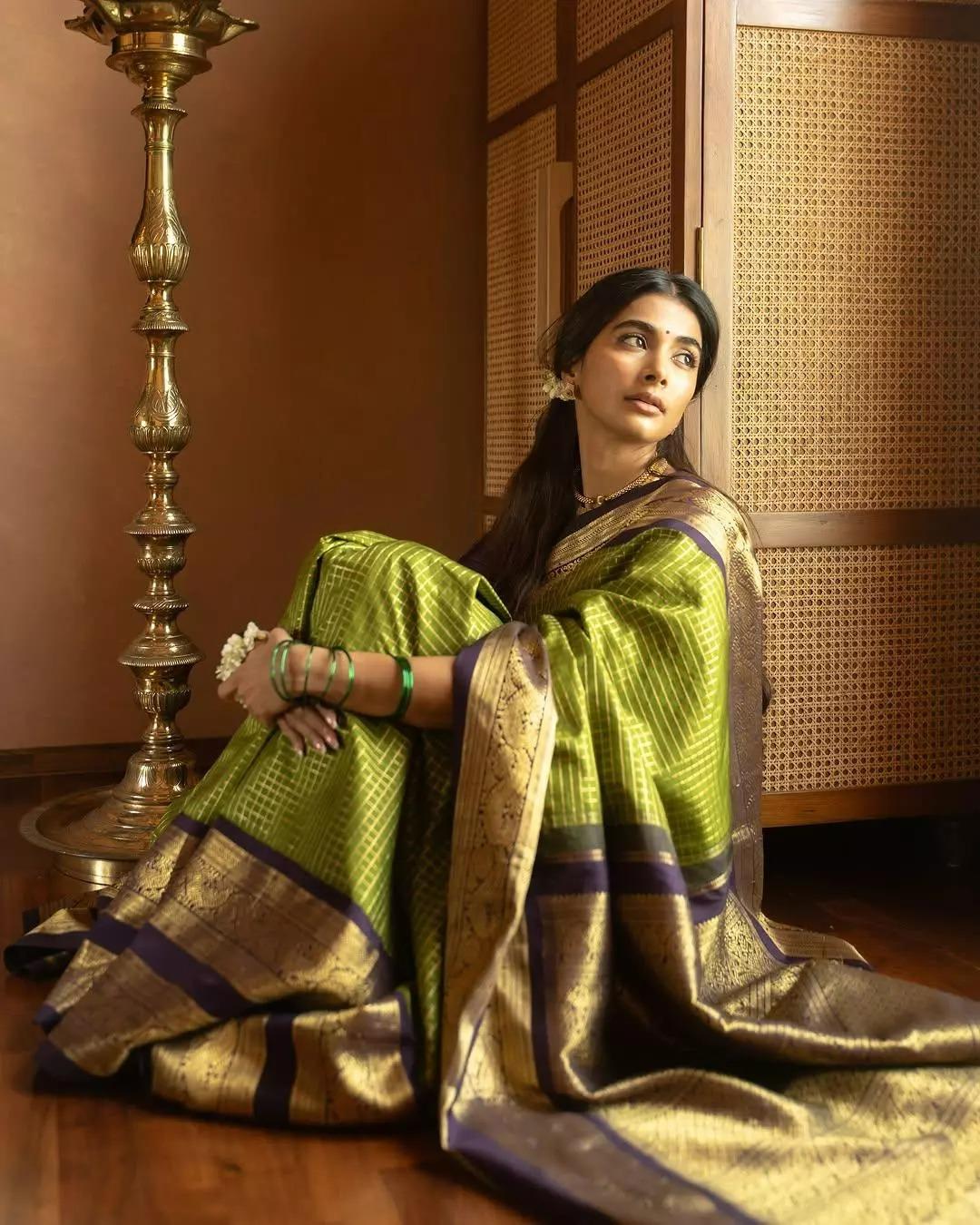 Pooja Hegde Sitting Thoughtfully in Traditional Saree