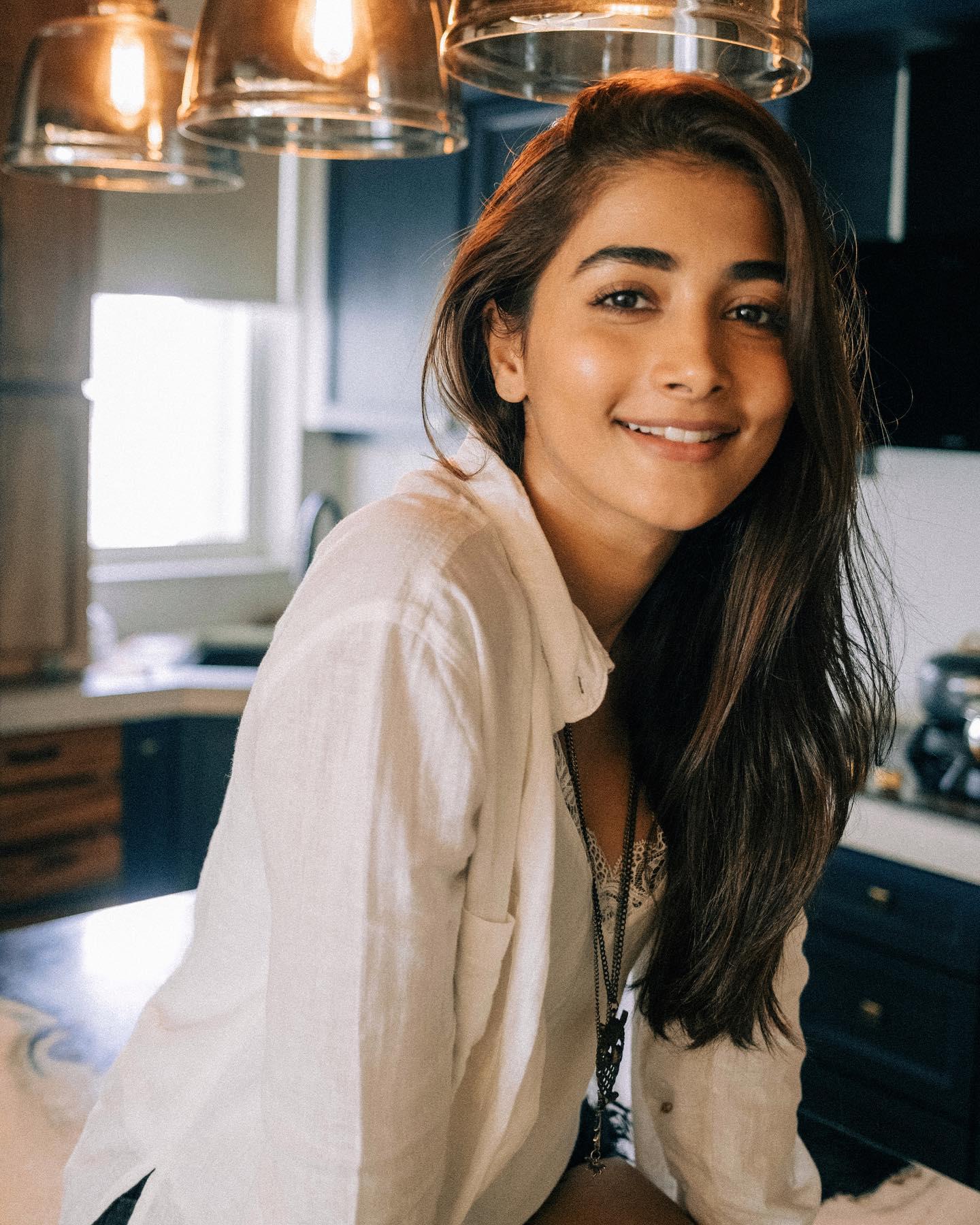 Pooja Hegde Smiles Casually in a Cozy Kitchen Setup