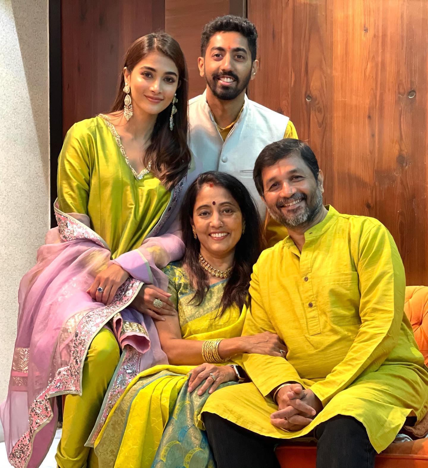 Pooja Hegde Smiles with Family in Festive Clothes Wallpaper