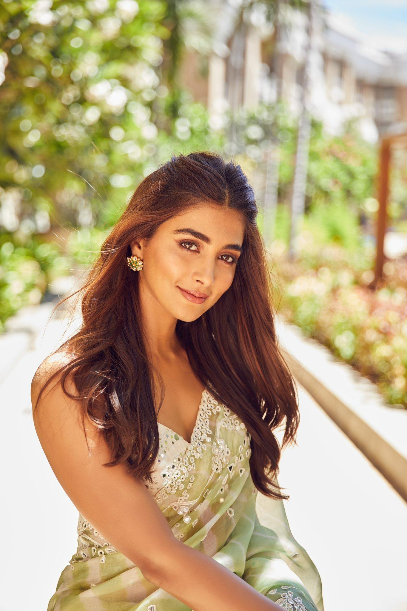 Pooja Hegde Smiling in Nature Wearing Sleeveless Top
