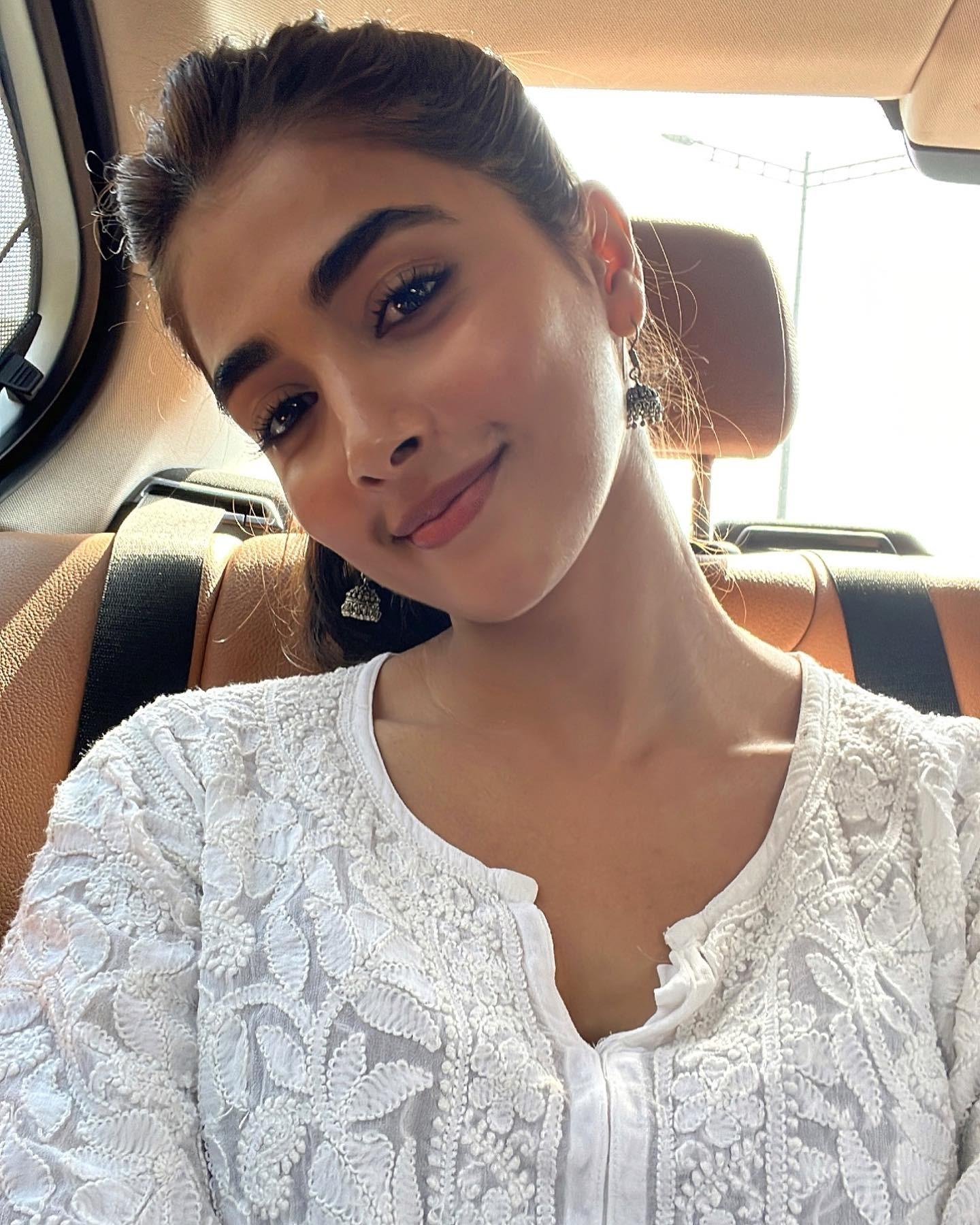 Pooja Hegde Smiling in Selfie Wearing Cozy White Knit Sweater