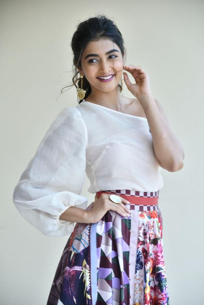 Pooja Hegde Smiling in White Top and Printed Skirt