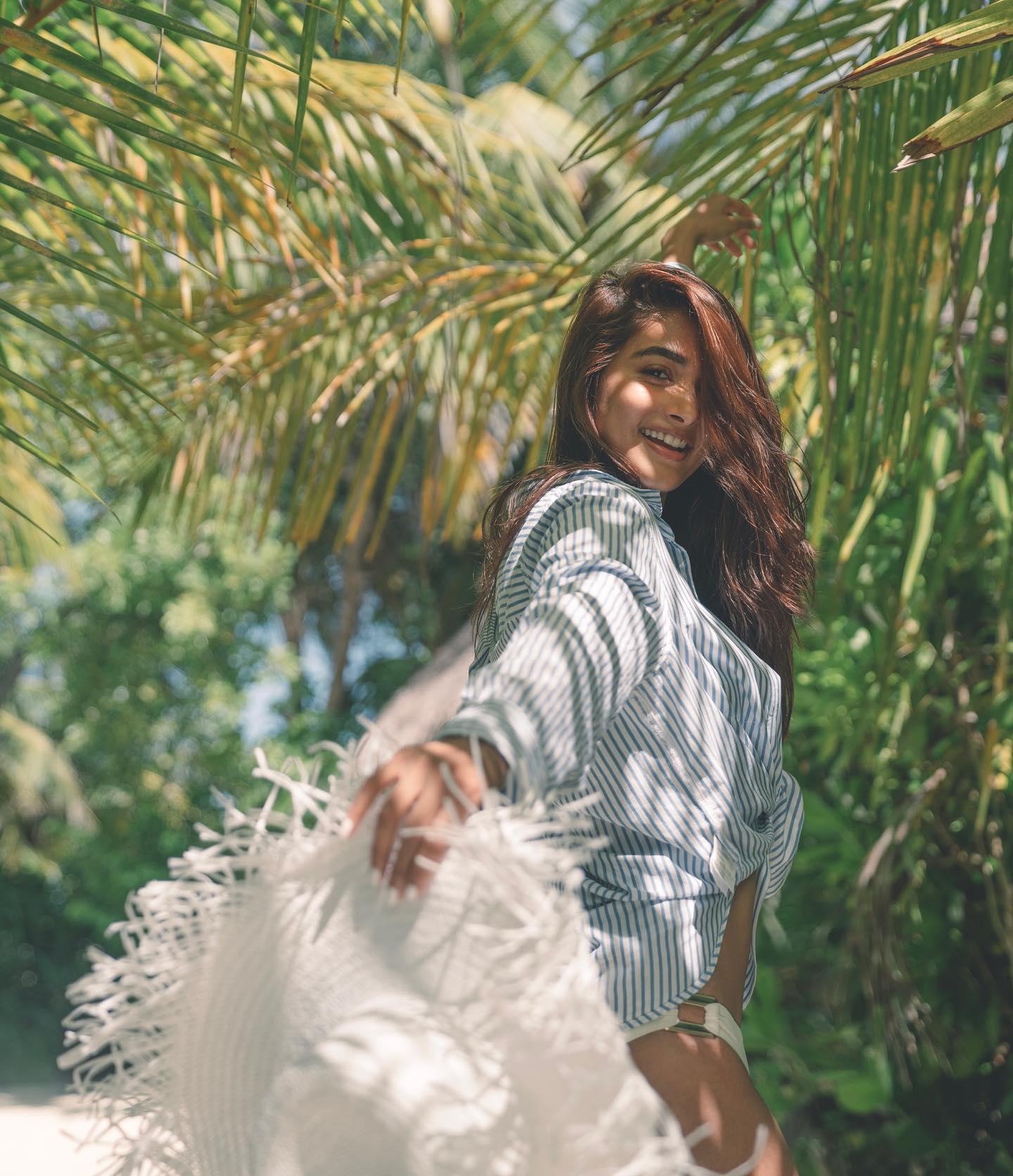 Pooja Hegde Smiling Outdoors in a Breezy White Outfit