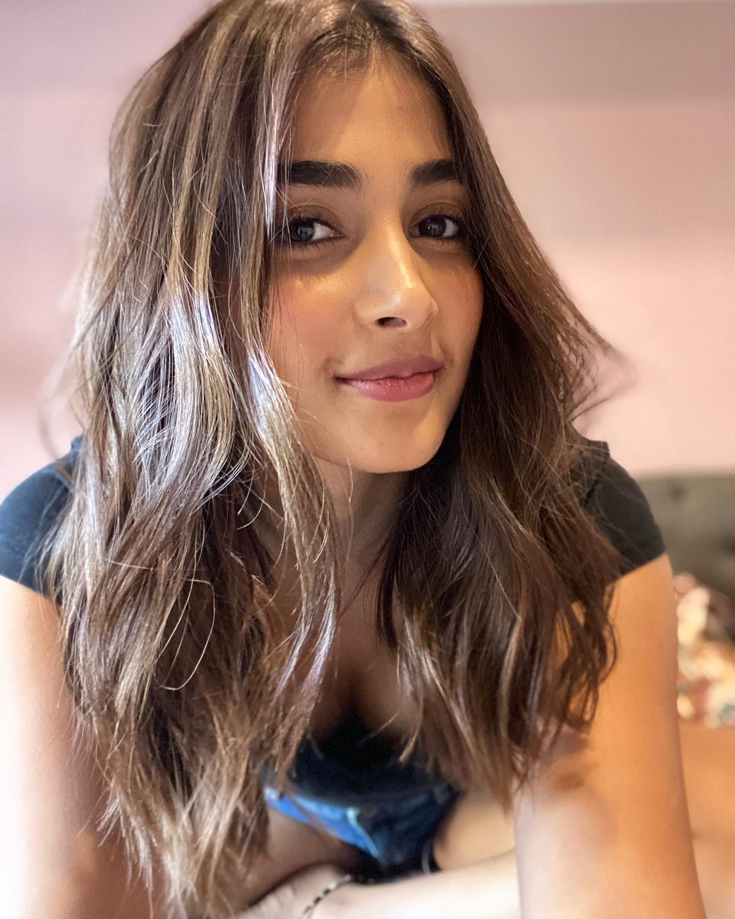 Pooja Hegde Smiling with Wavy Hair in Casual Selfie Image