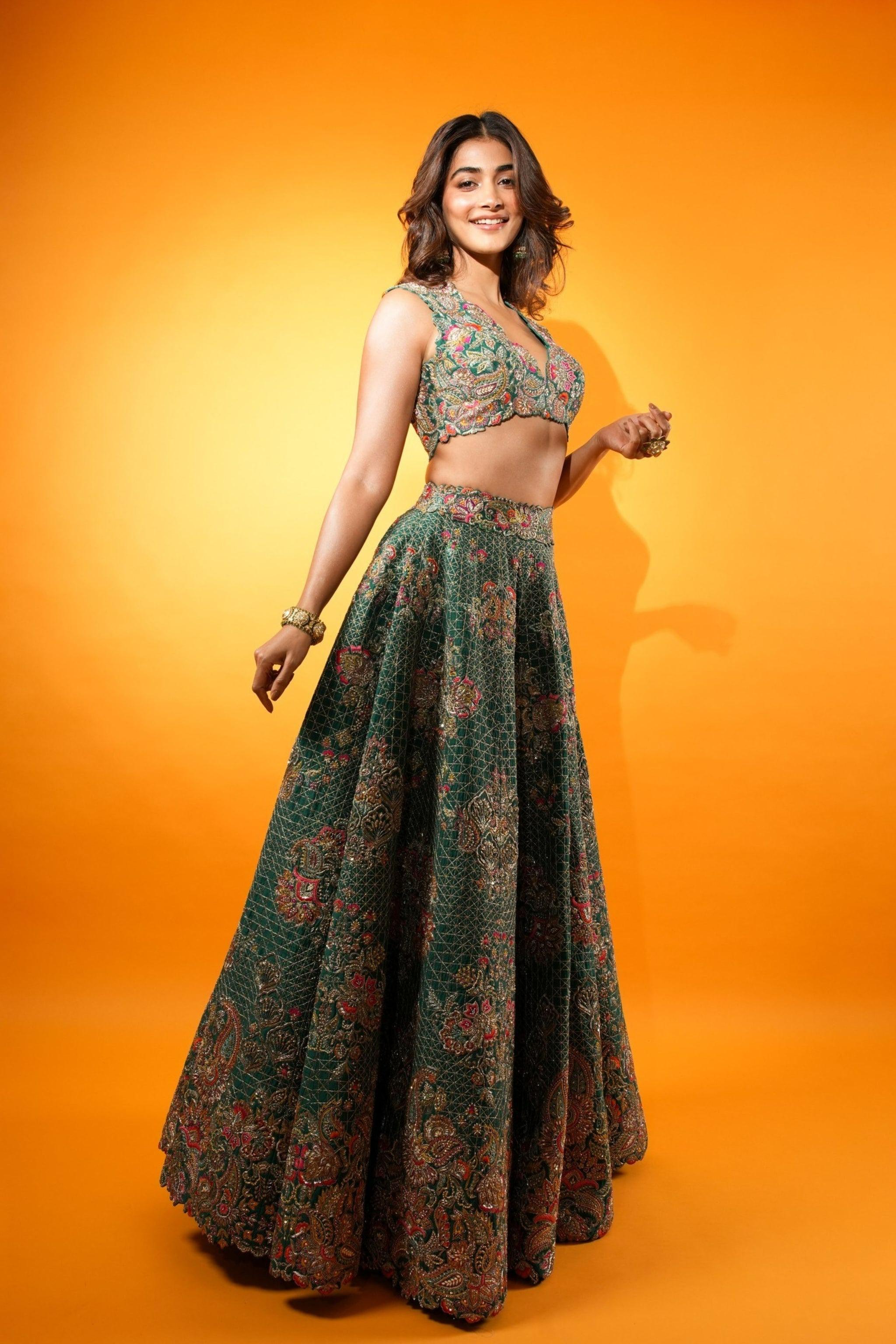 Pooja Hegde Standing Confidently in Green Lehenga Wallpaper
