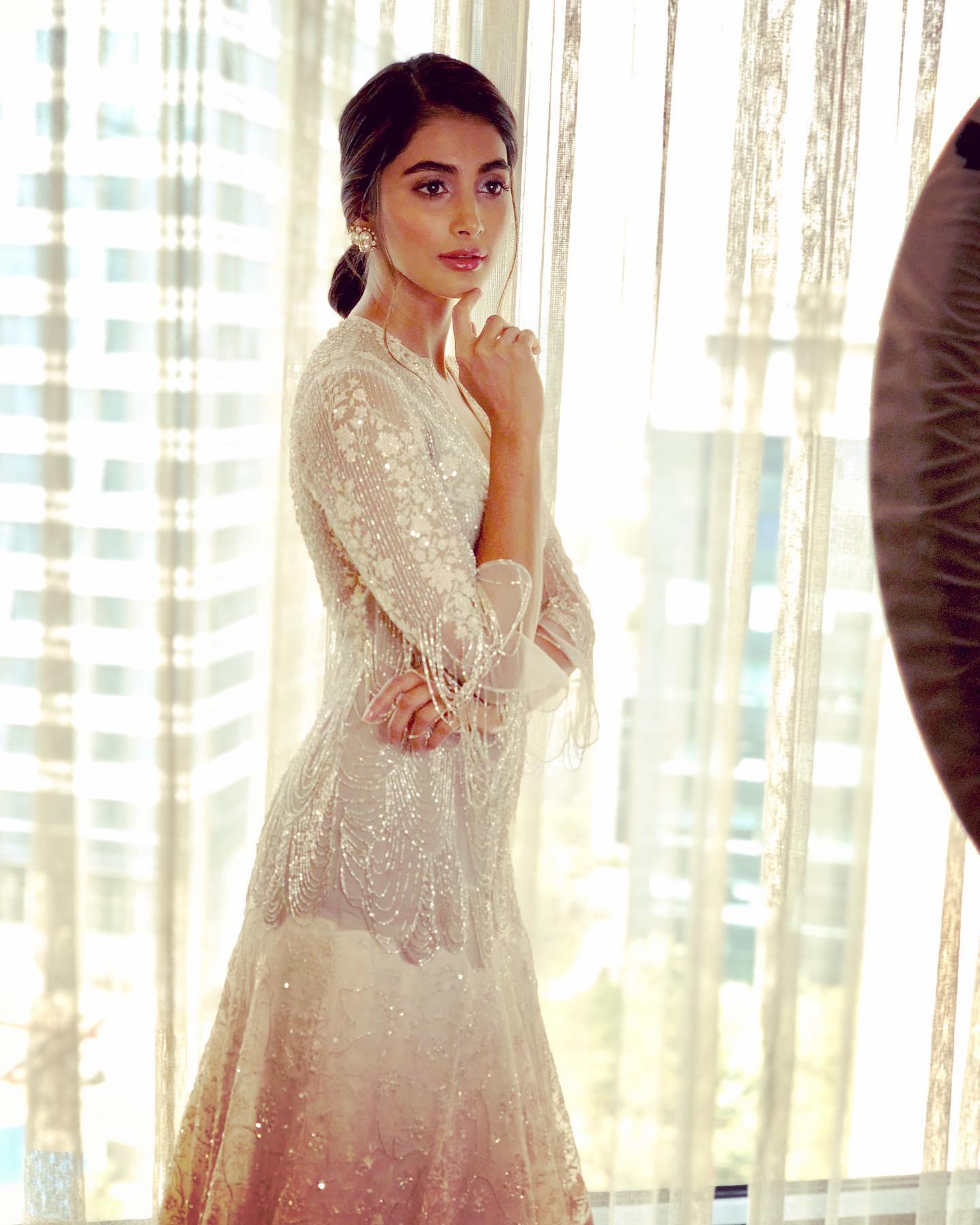 Pooja Hegde Standing Near Window Wearing White Dress