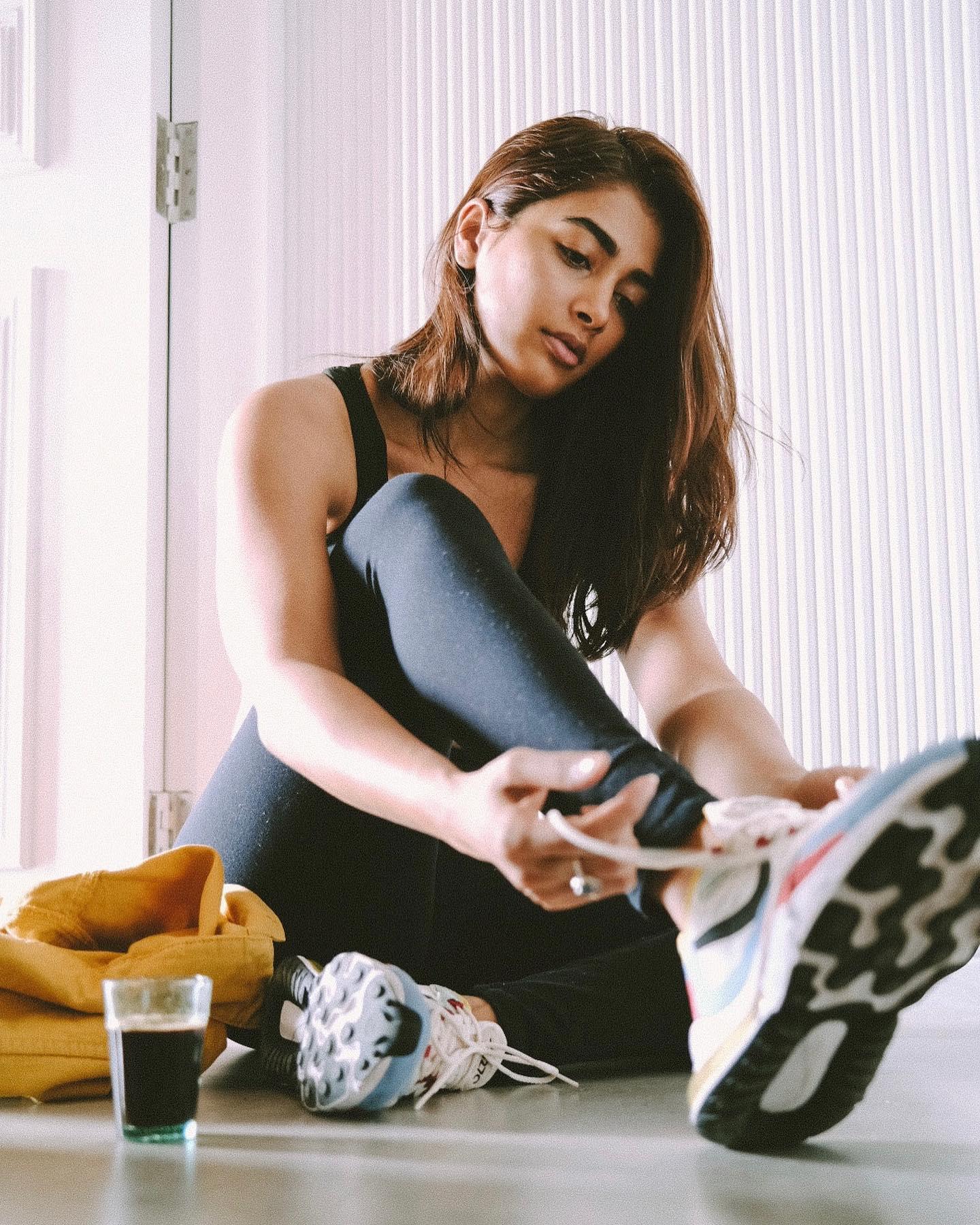Pooja Hegde Stretches Indoors in Comfy Black Athleisure