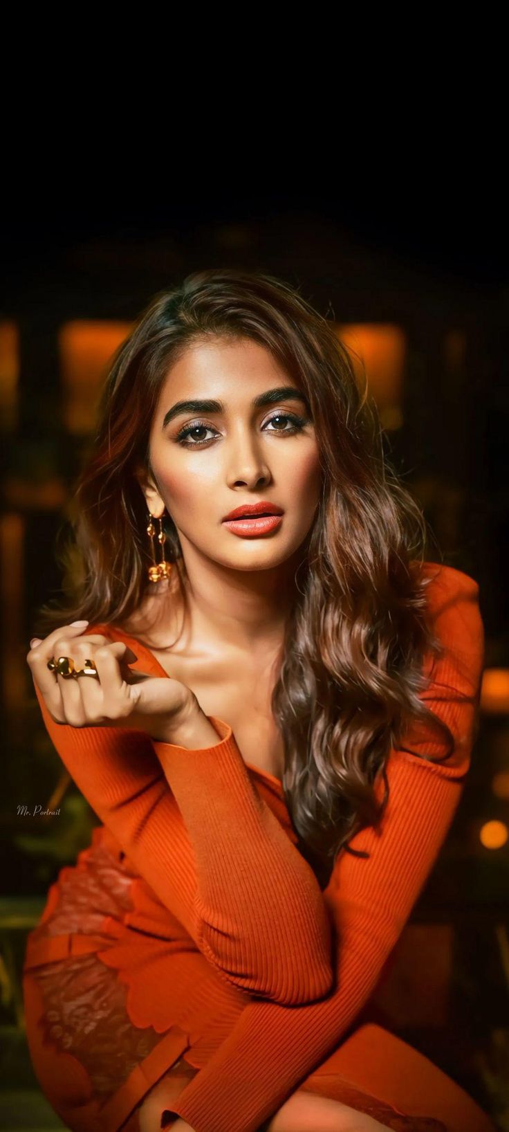 Pooja Hegde Strikes a Serious Pose Wearing Orange Outfit