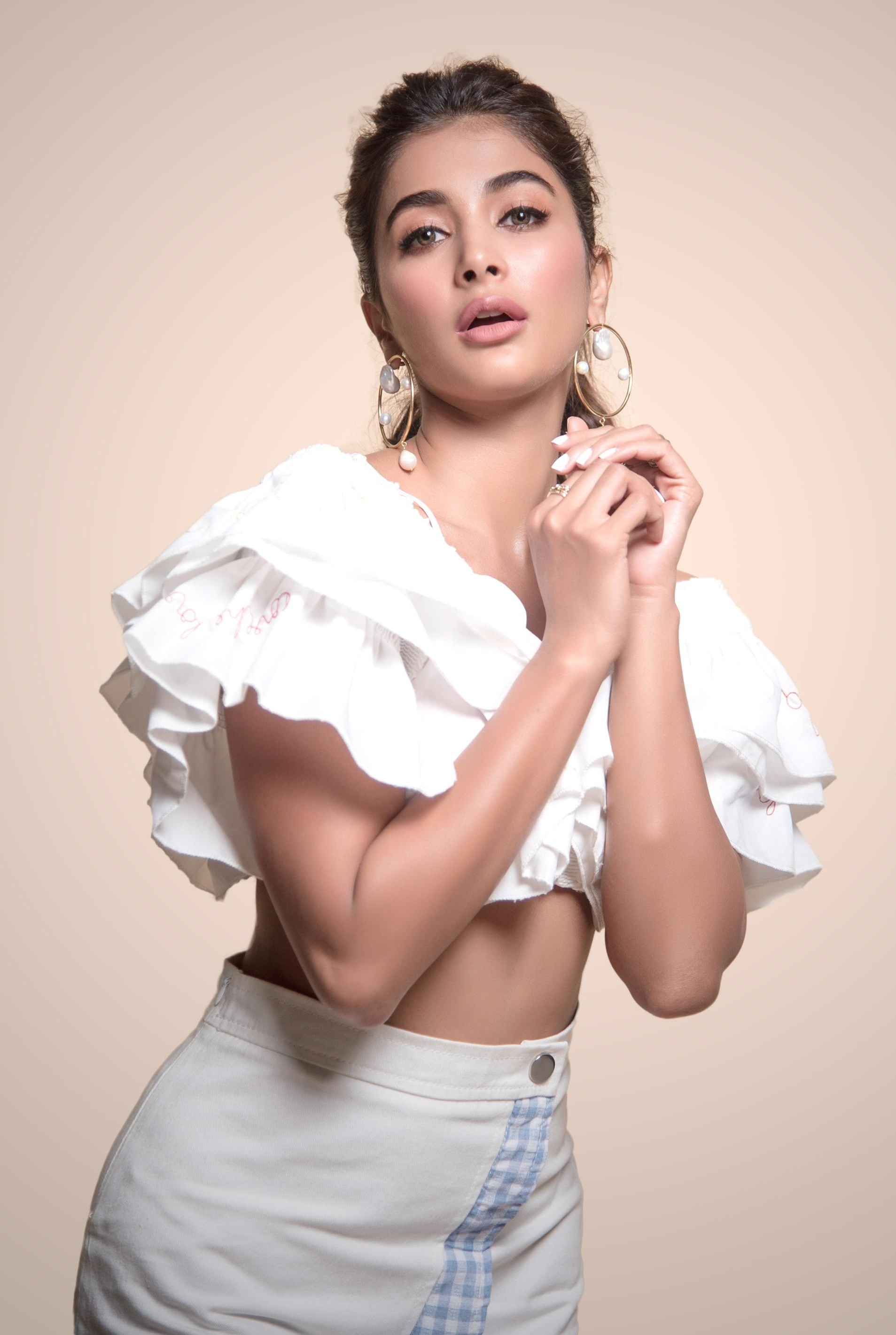 Pooja Hegde Striking Pose in White Ruffled Crop Top Image