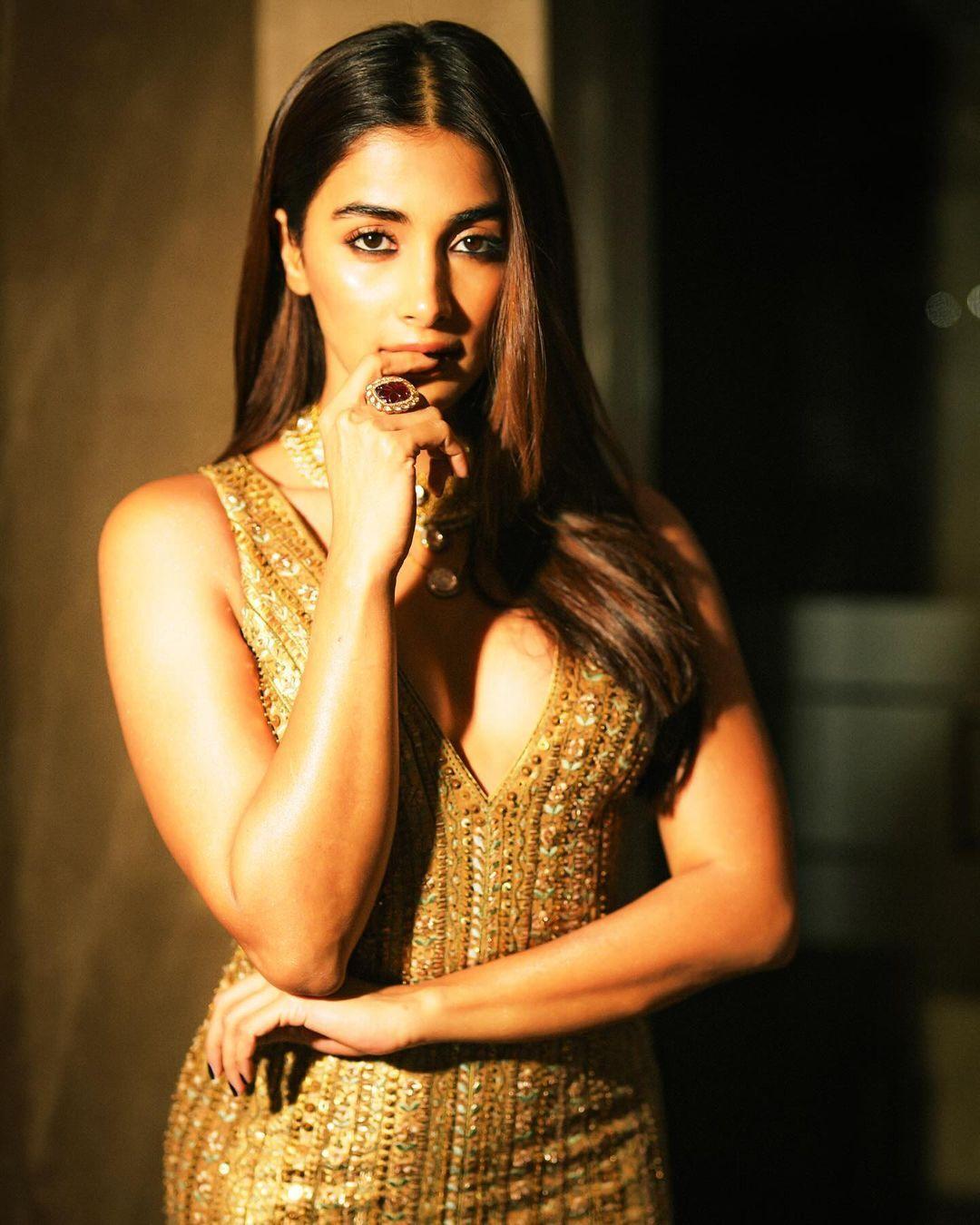 Pooja Hegde Stuns in Golden Dress with Confident Pose