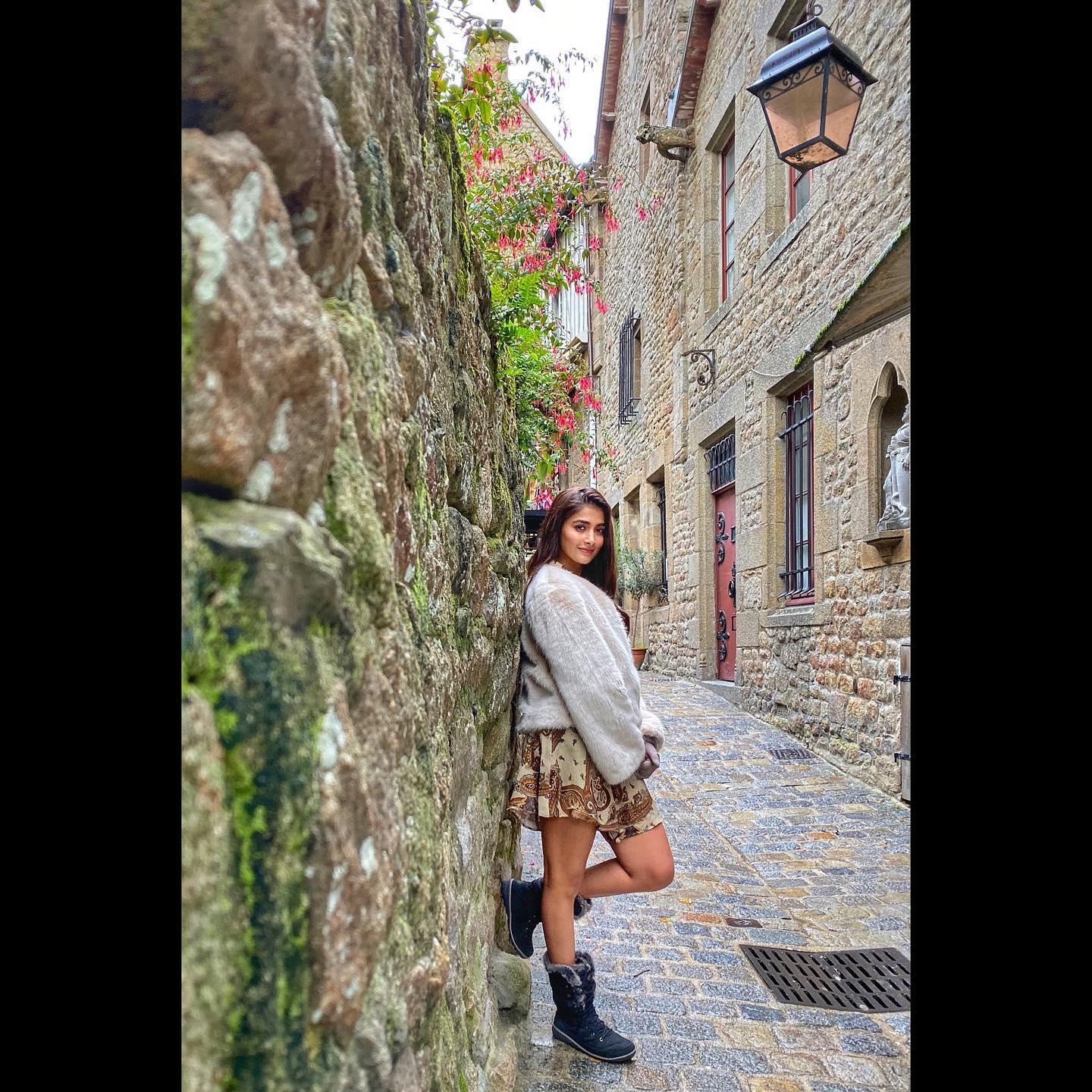 Pooja Hegde Walking on Stone Street in Cozy Outfit