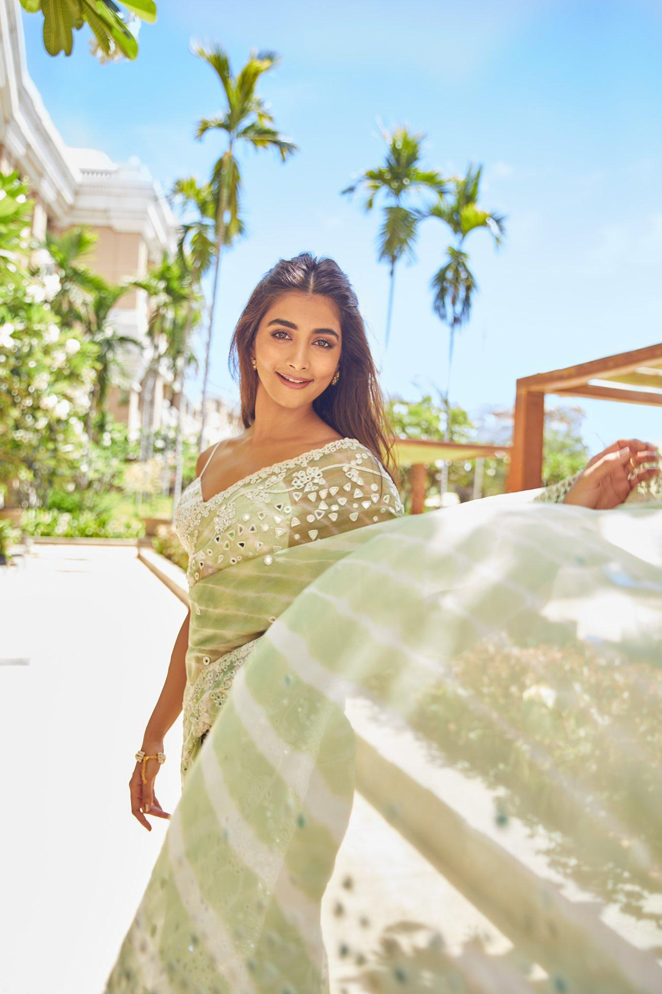 Pooja Hegde Walking Outdoors Wearing Elegant Saree Image