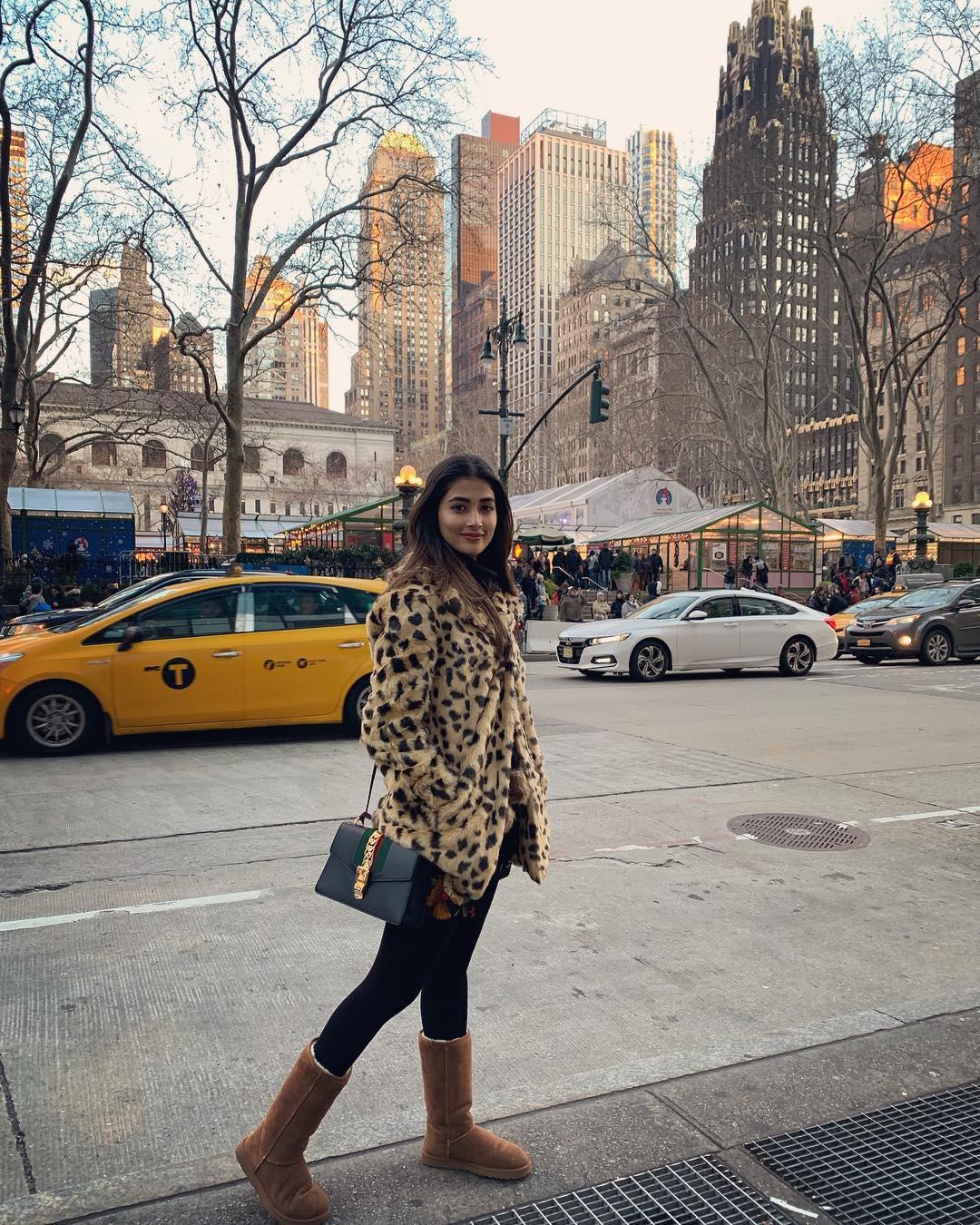 Pooja Hegde Walks Winter Street in Fur Coat and Boots