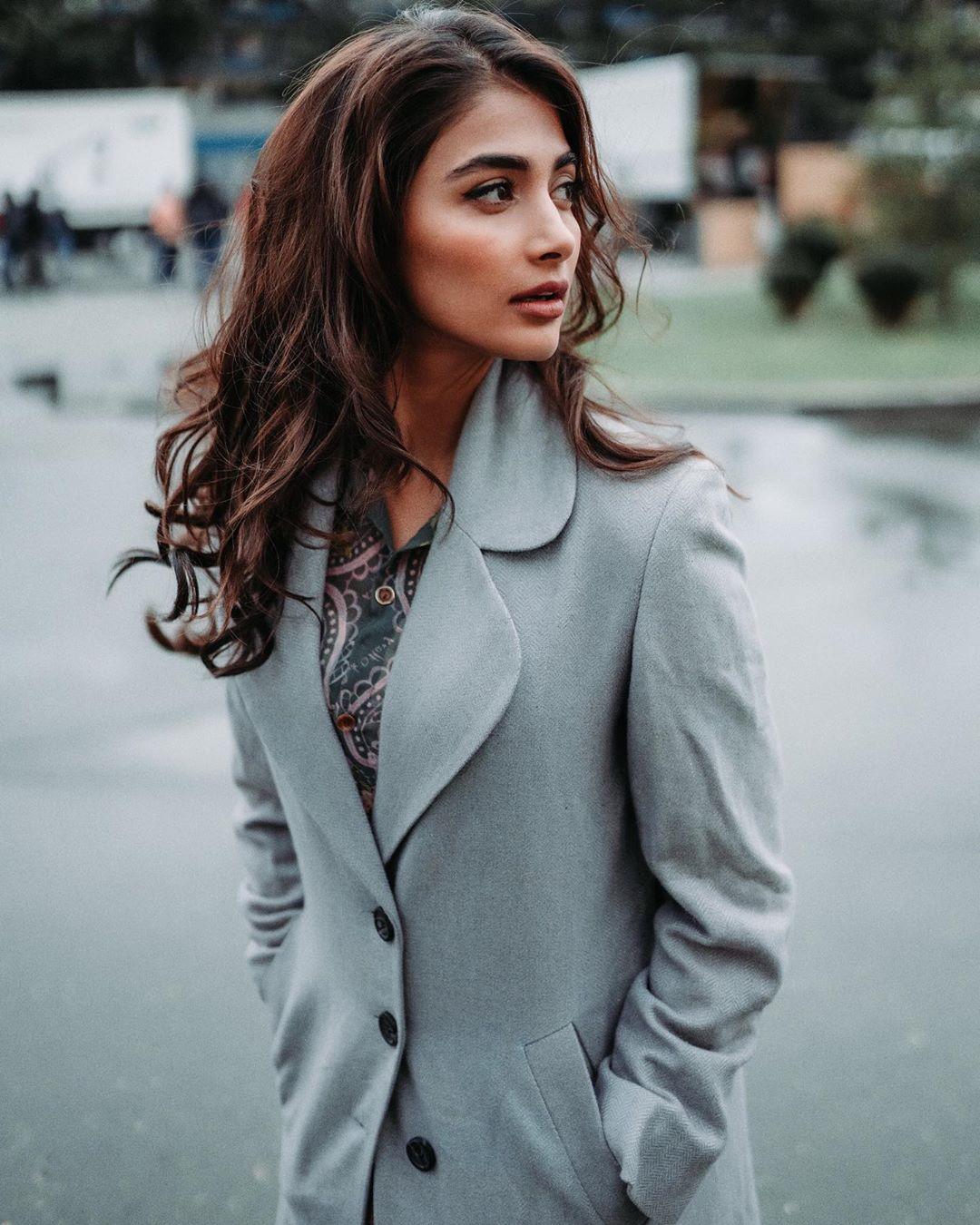 Pooja Hegde Wearing Grey Coat Looking To the Side Wallpaper