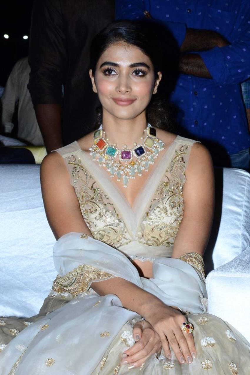Pooja Hegde Wearing Heavy Jewelry in a Golden Gown Image