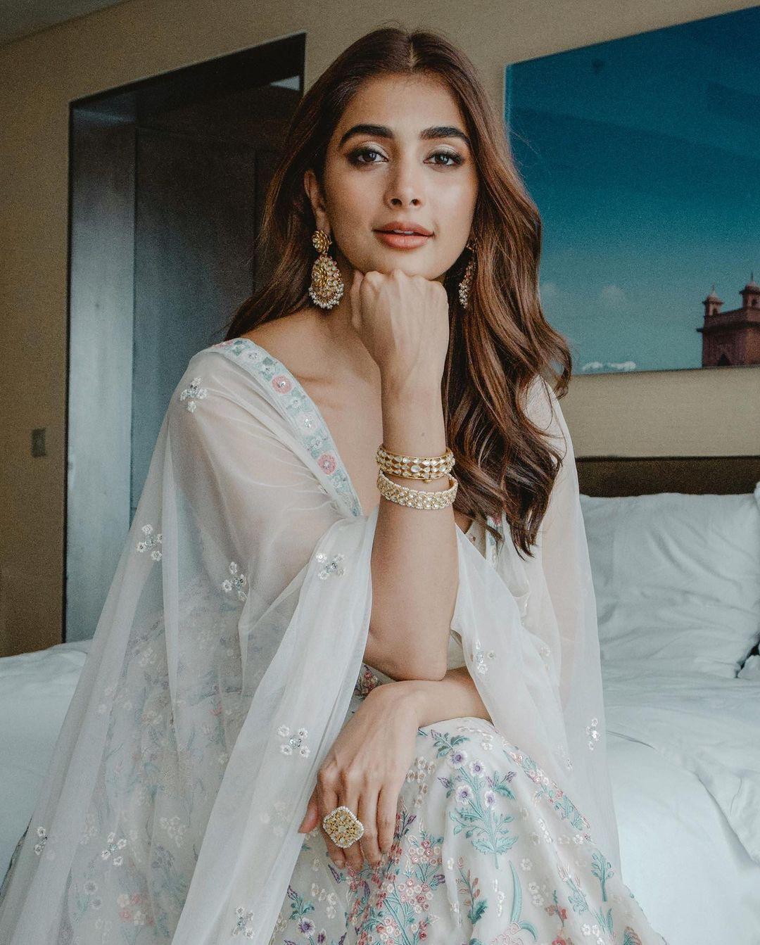 Pooja Hegde Wearing White Traditional Outfit Sitting