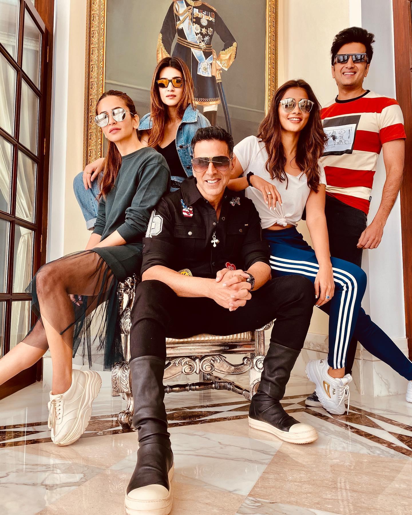 Pooja Hegde with Friends Posing Casually Near Stair Railing