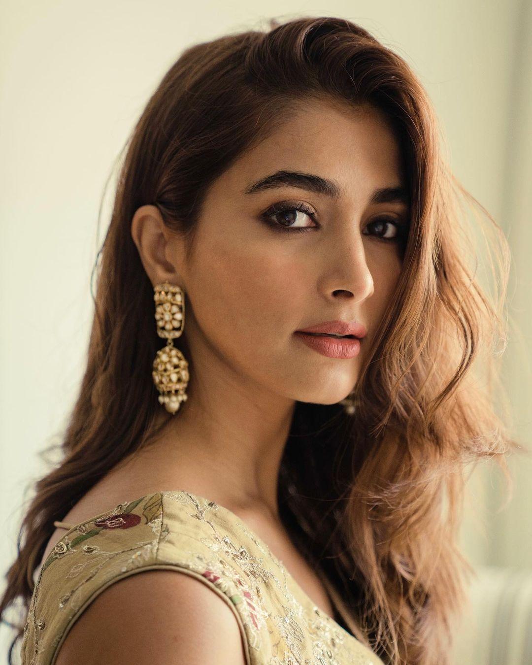 Pooja Hegde with Long Hair and Heavy Earrings Posing Indoors