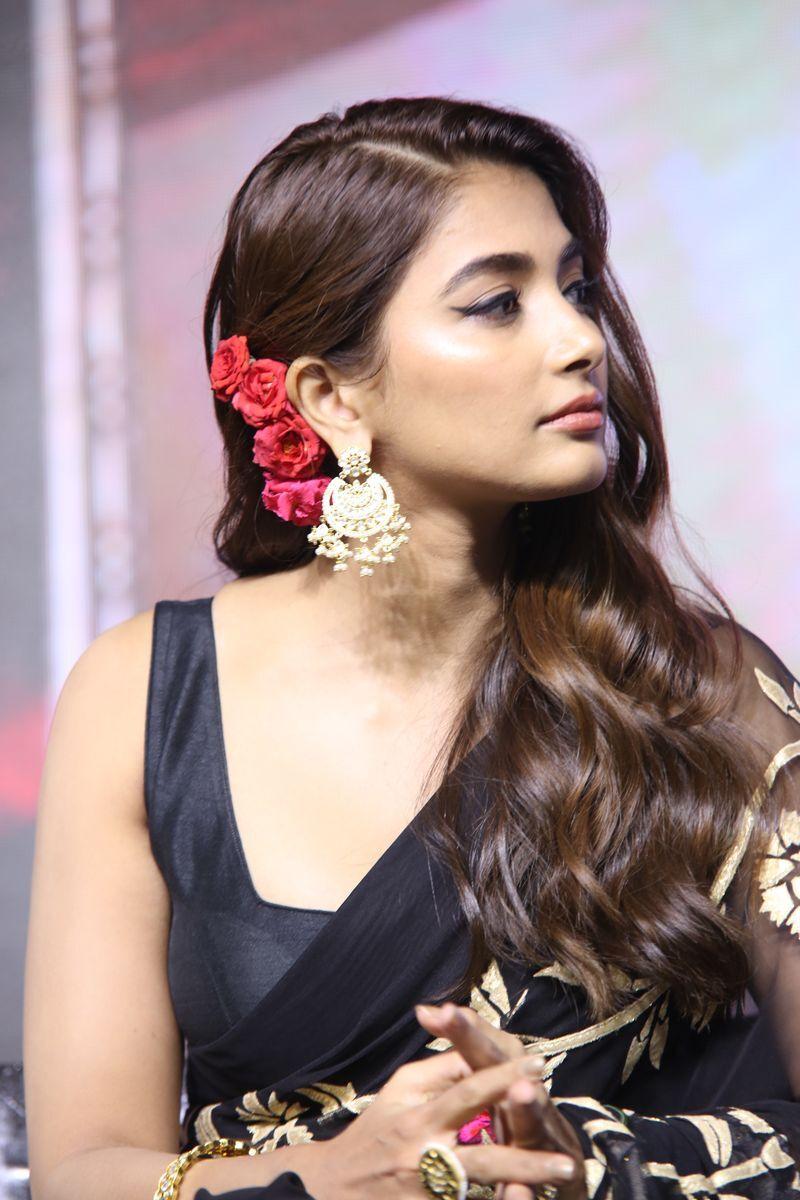 Pooja Hegde with Red Flower in Hair Looks Stunning Image