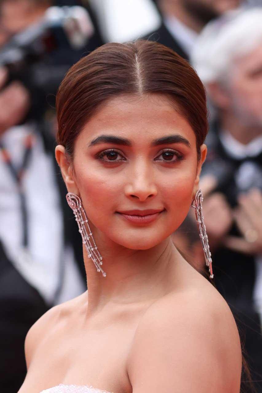 Pooja Hegde with Sleek Bun Look At Film Festival Appearance
