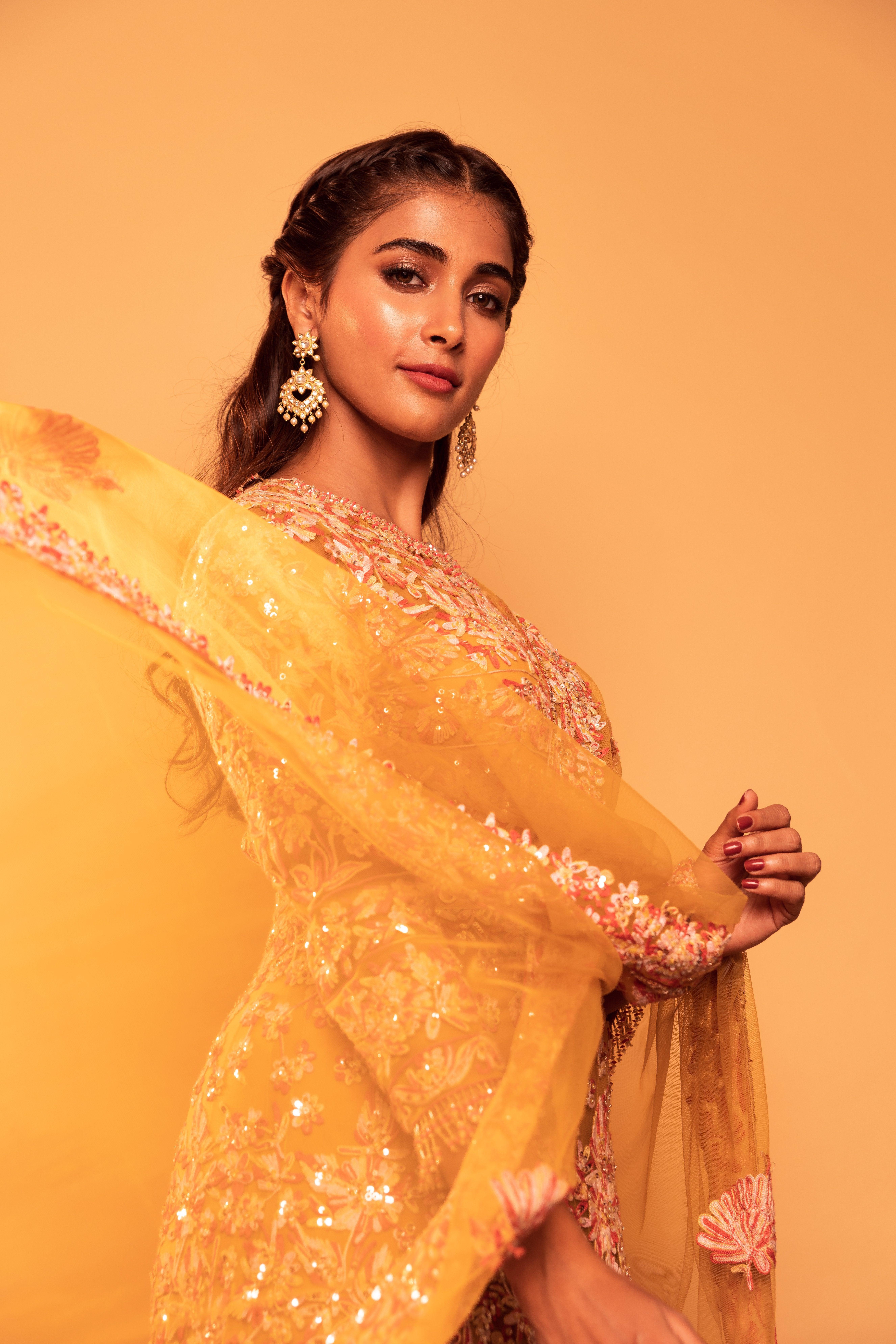 Radiant Pooja Hegde in Golden Outfit Posing Confidently