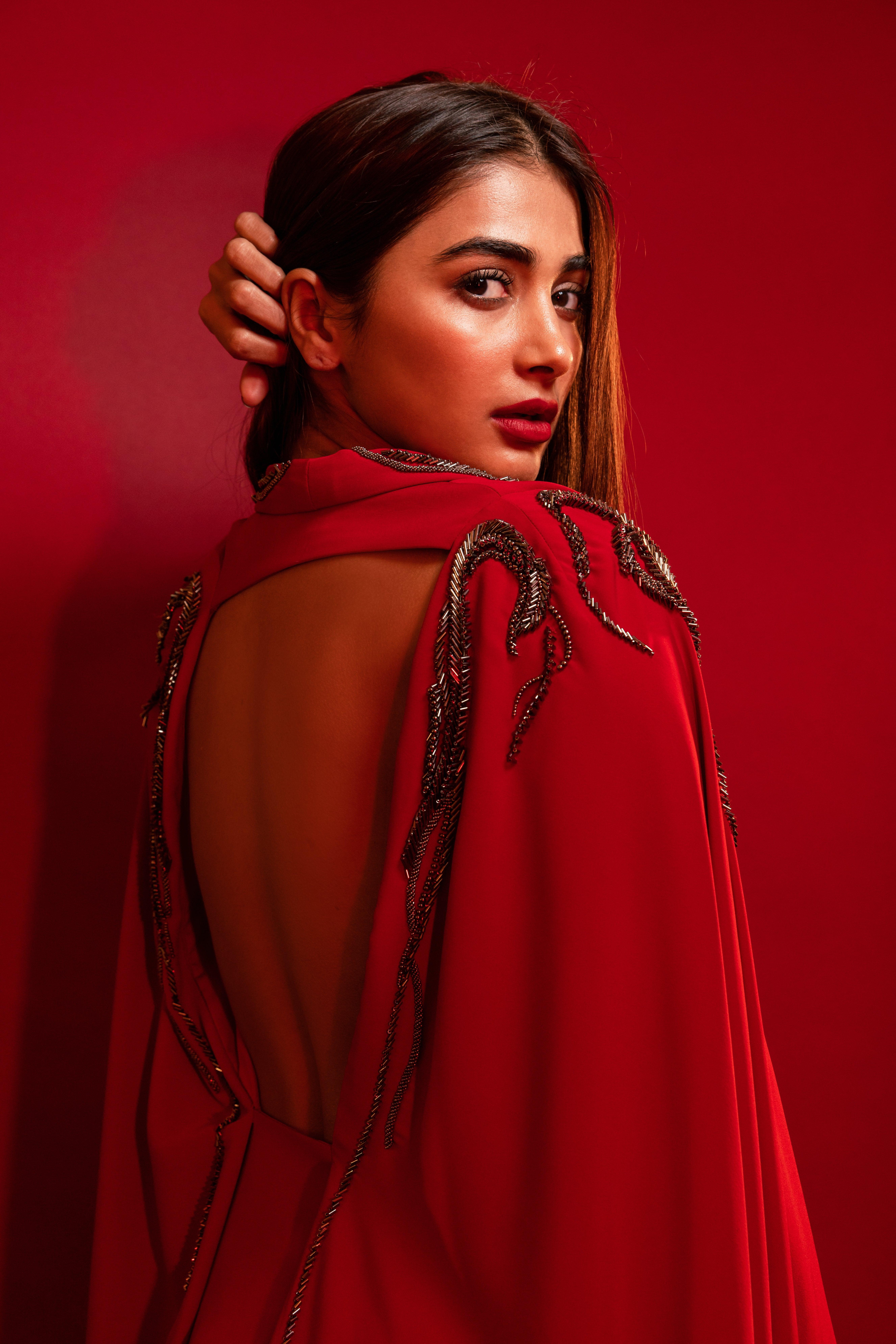 Rear Pose of Pooja Hegde in Deep Red Dress with Open Back