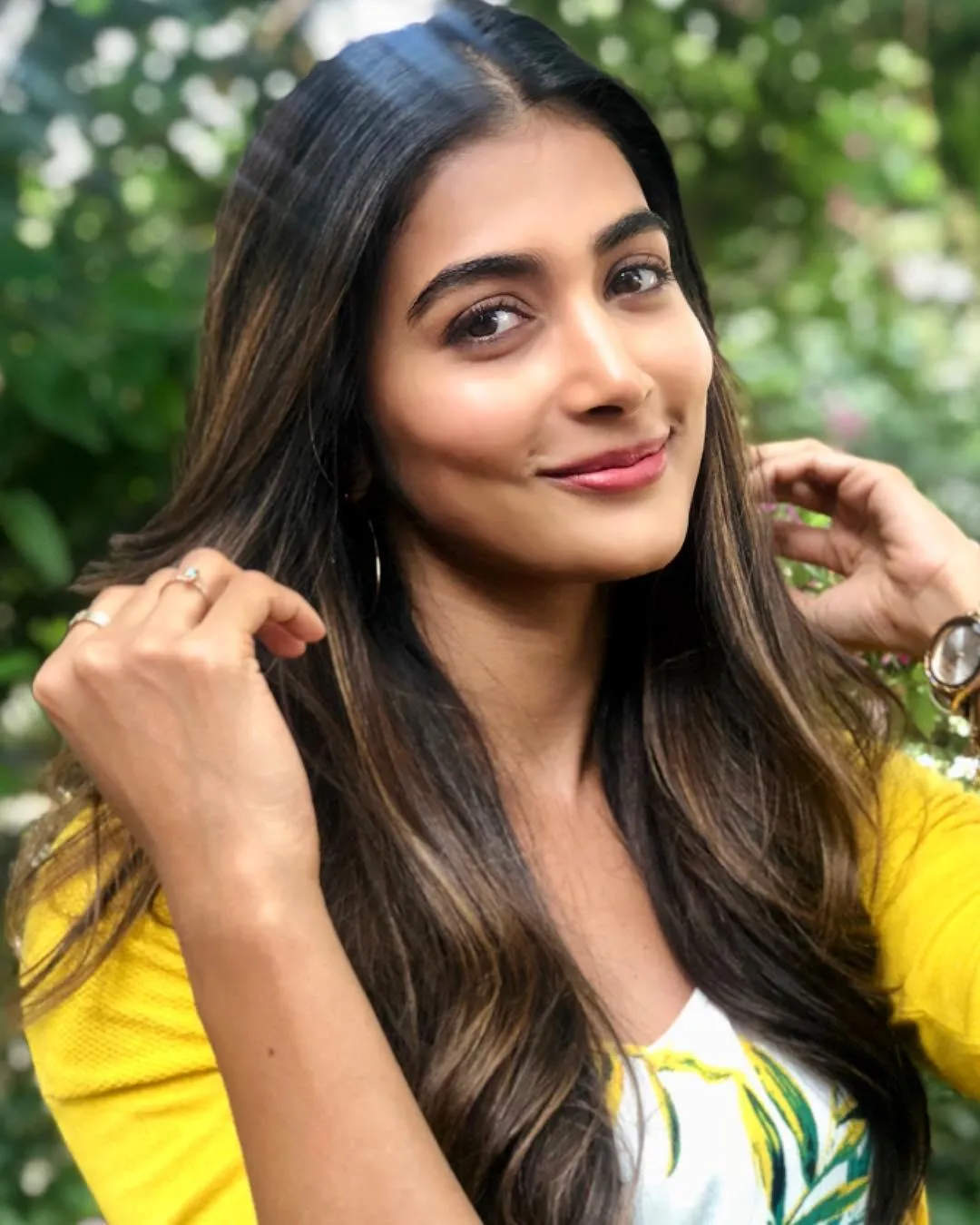 Bright and Happy Pooja Hegde Wearing Yellow Top Outdoors