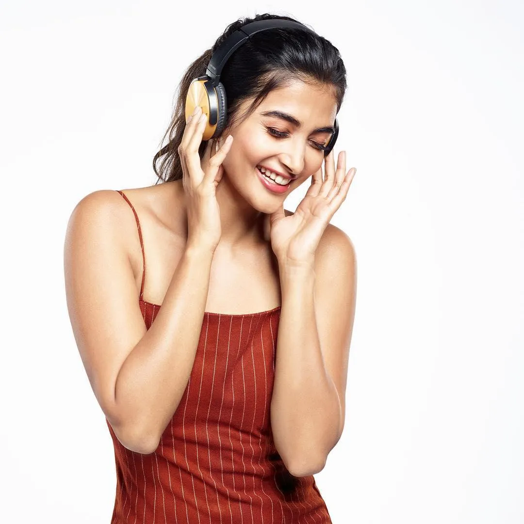Candid Joyful Smile of Pooja Hegde in Sleeveless Dress