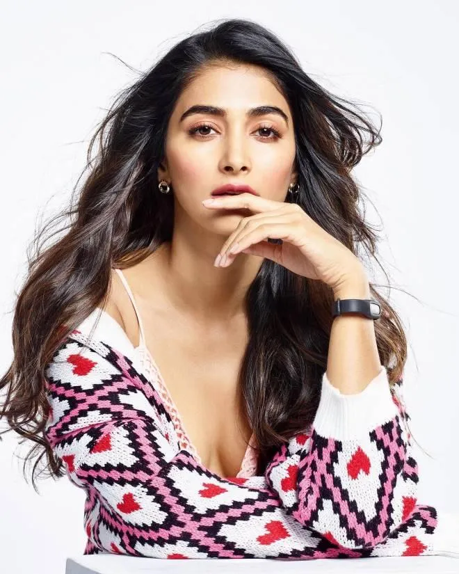 Casual and Relaxed Pose of Pooja Hegde in a Knit Sweater