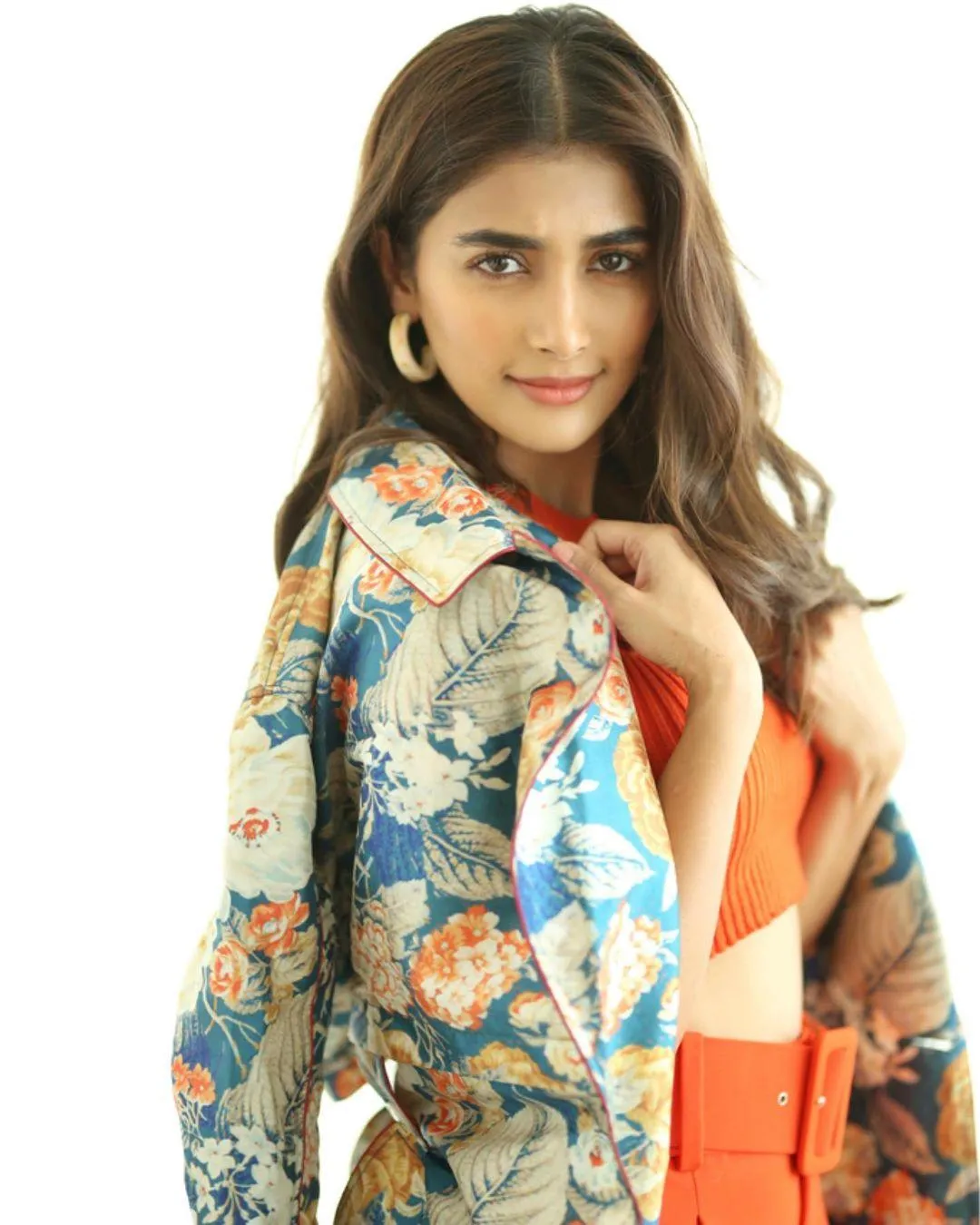 Charming Pooja Hegde Wearing Floral Jacket and Orange Dress