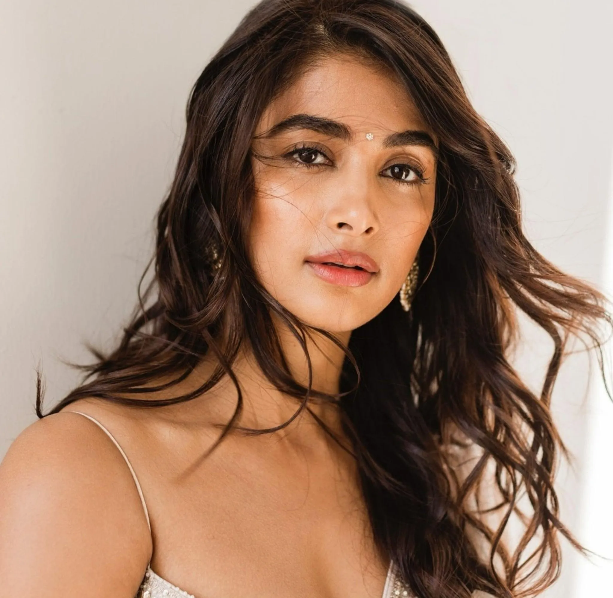 Closeup of Pooja Hegde in White Top with Soft Lighting