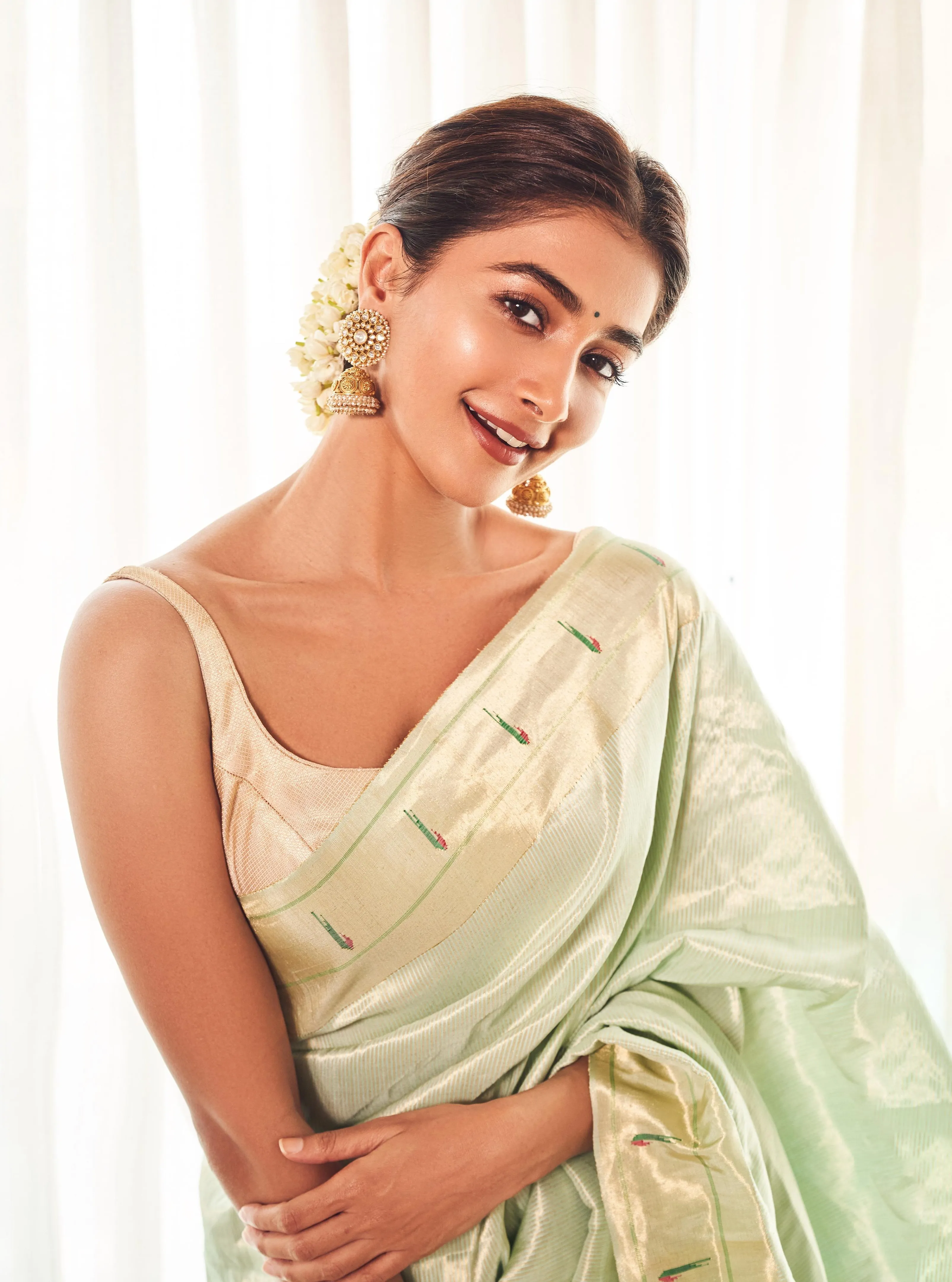 Elegant Pooja Hegde in Mint Green Saree Looking Down