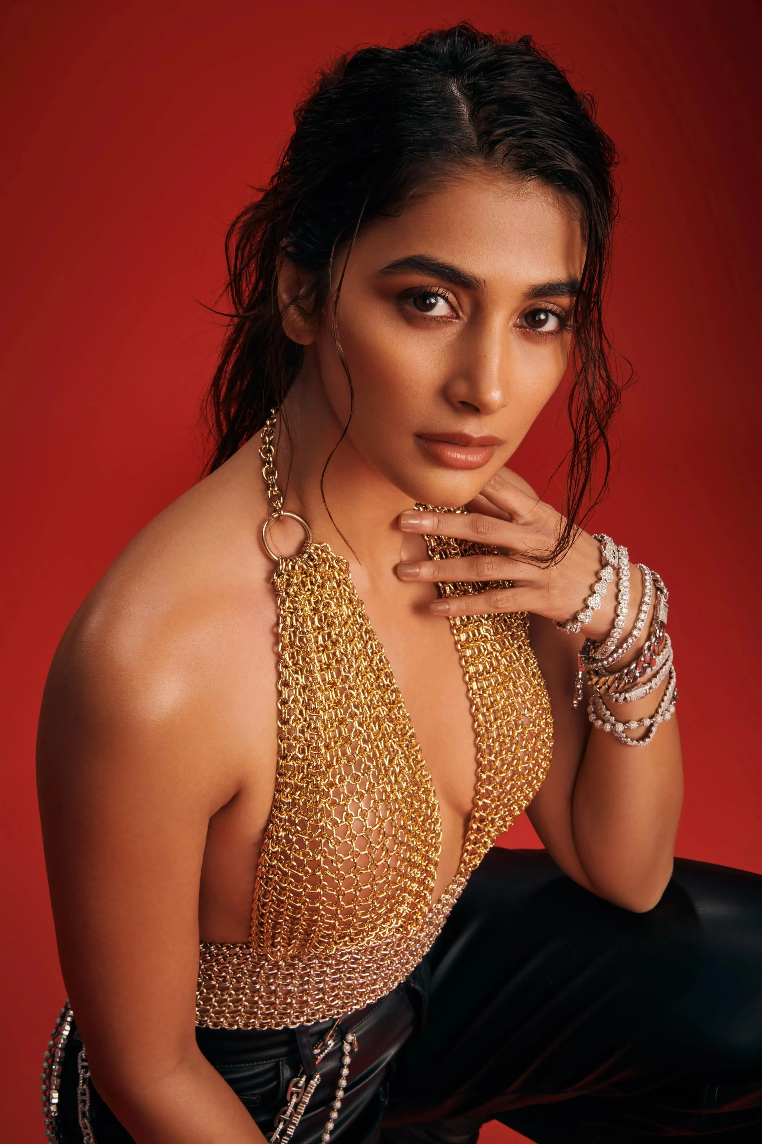 Glamorous Pooja Hegde Posing in Gold Halter Top Wallpaper