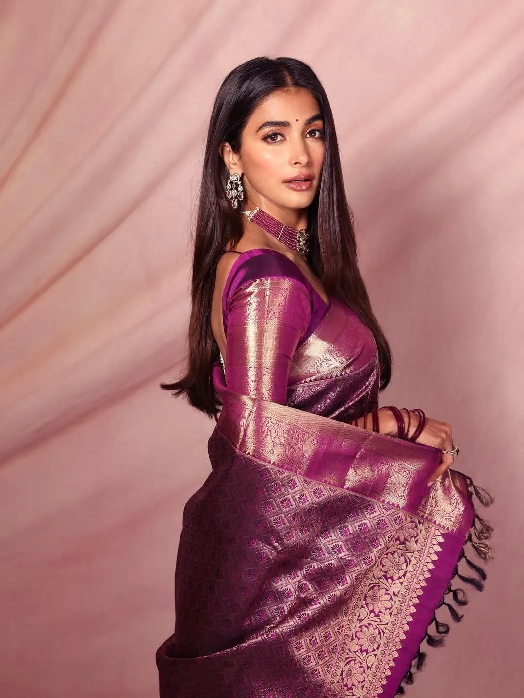 Graceful Pooja Hegde Wearing Purple Saree with Earrings