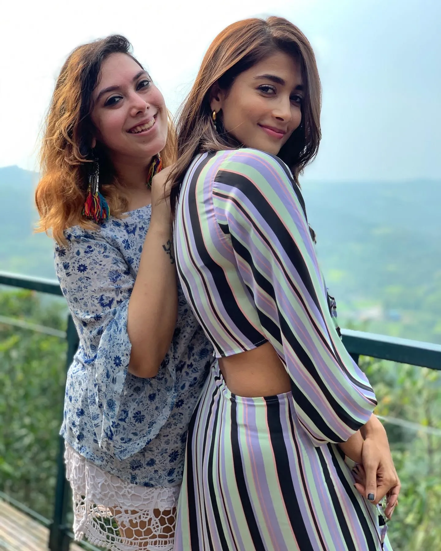 Pooja Hegde and Friend Pose on Scenic Balcony View Image
