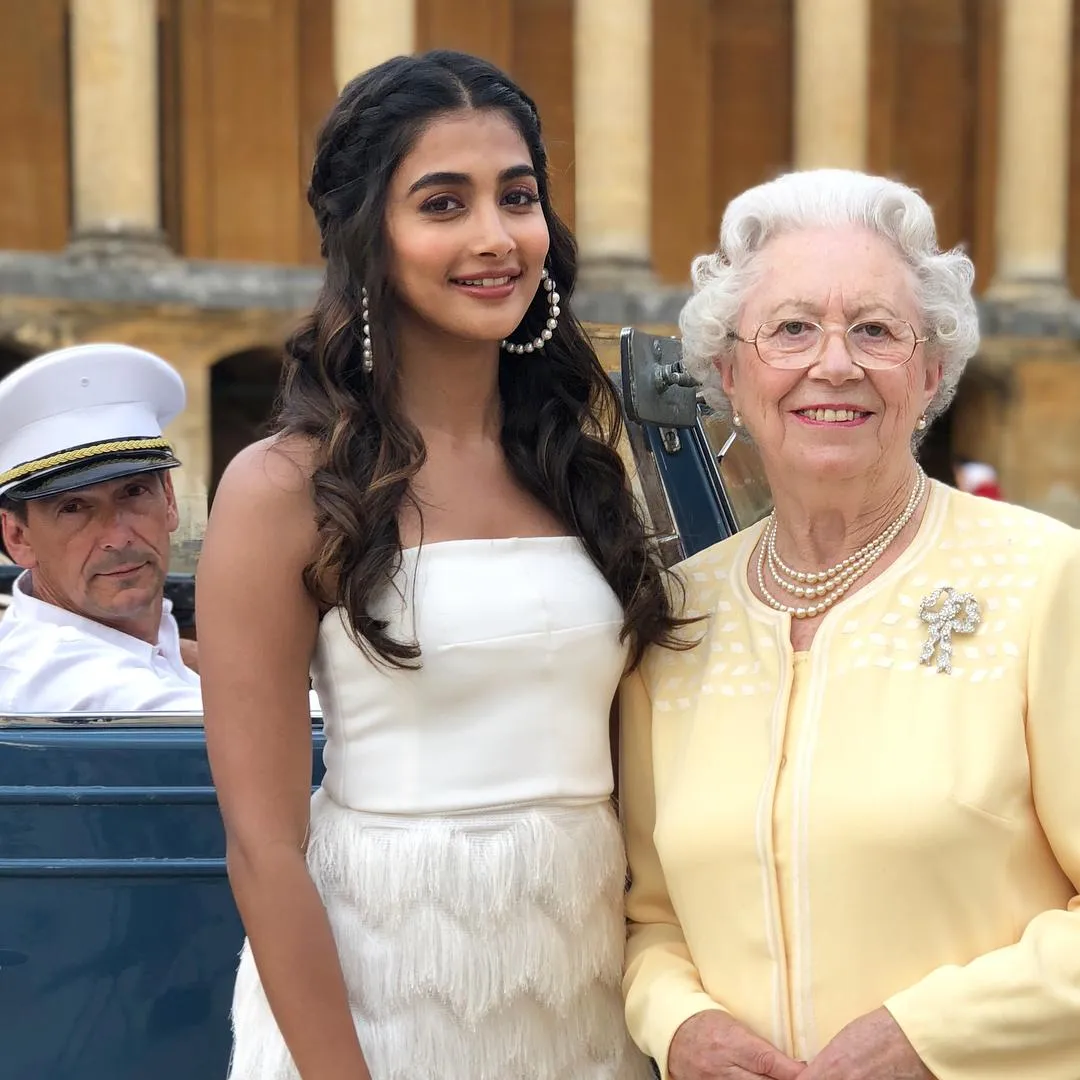 Pooja Hegde At Public Event with Elizabeth Smiling Image