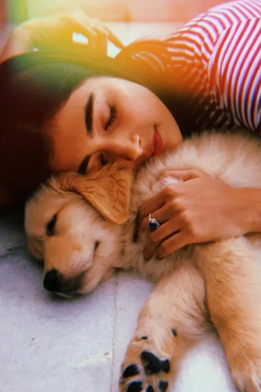 Pooja Hegde Cuddles a Puppy in a Heartwarming Moment Image