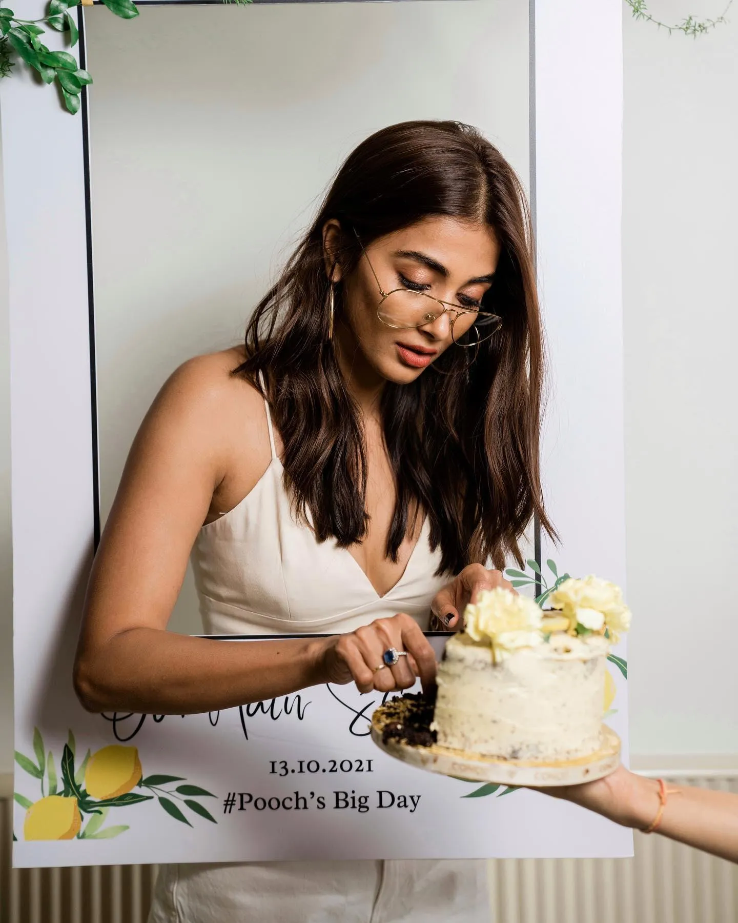 Pooja Hegde Cutting Cake Celebrating a Special Moment
