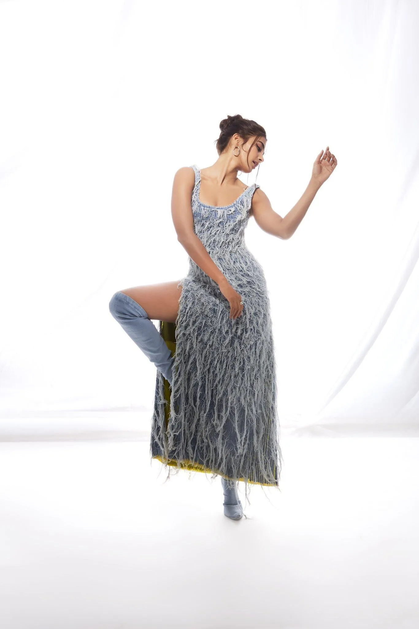 Pooja Hegde Dancing in a Black and Silver Gown Pose