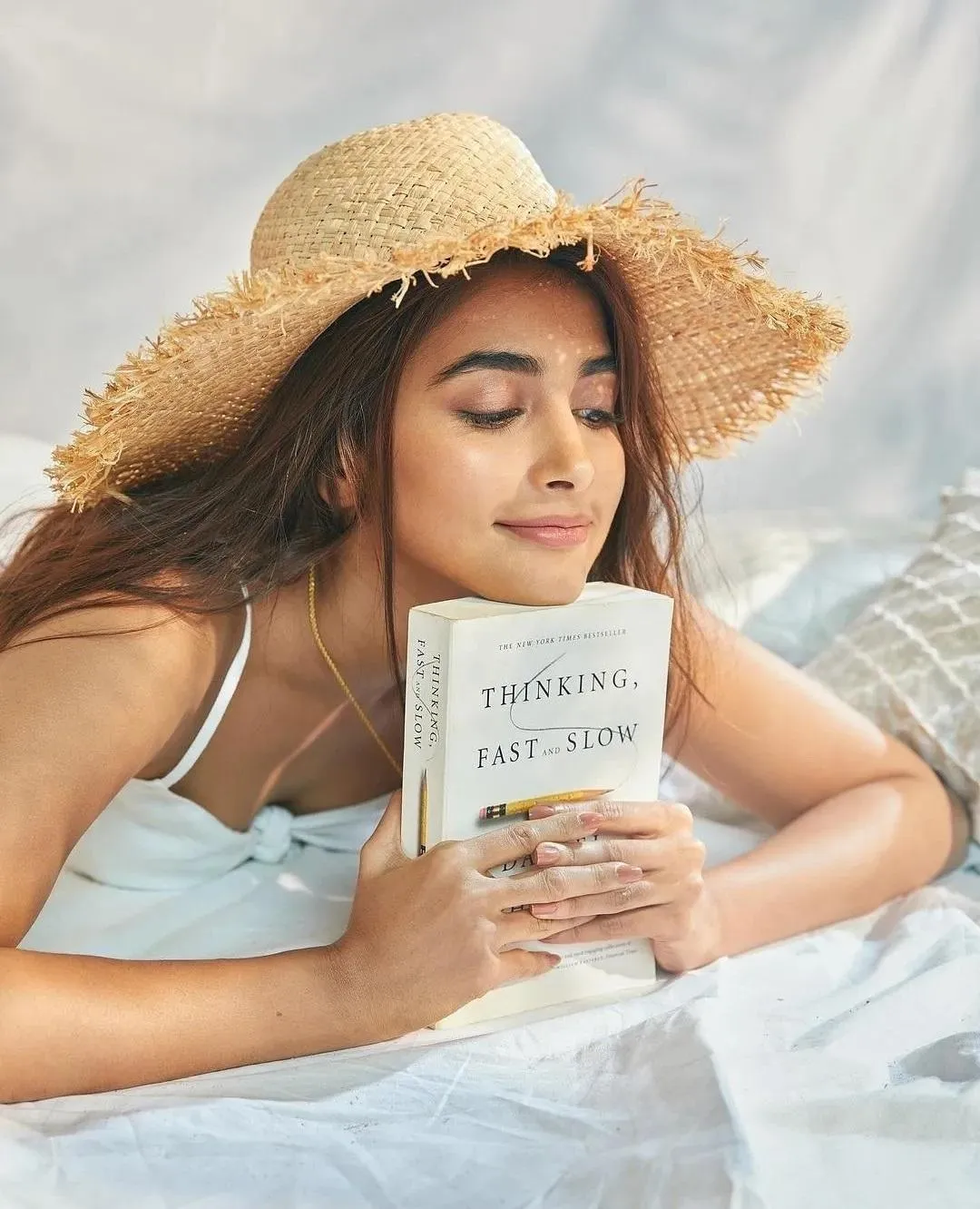 Pooja Hegde Enjoys Reading Outdoors in Summer Attire