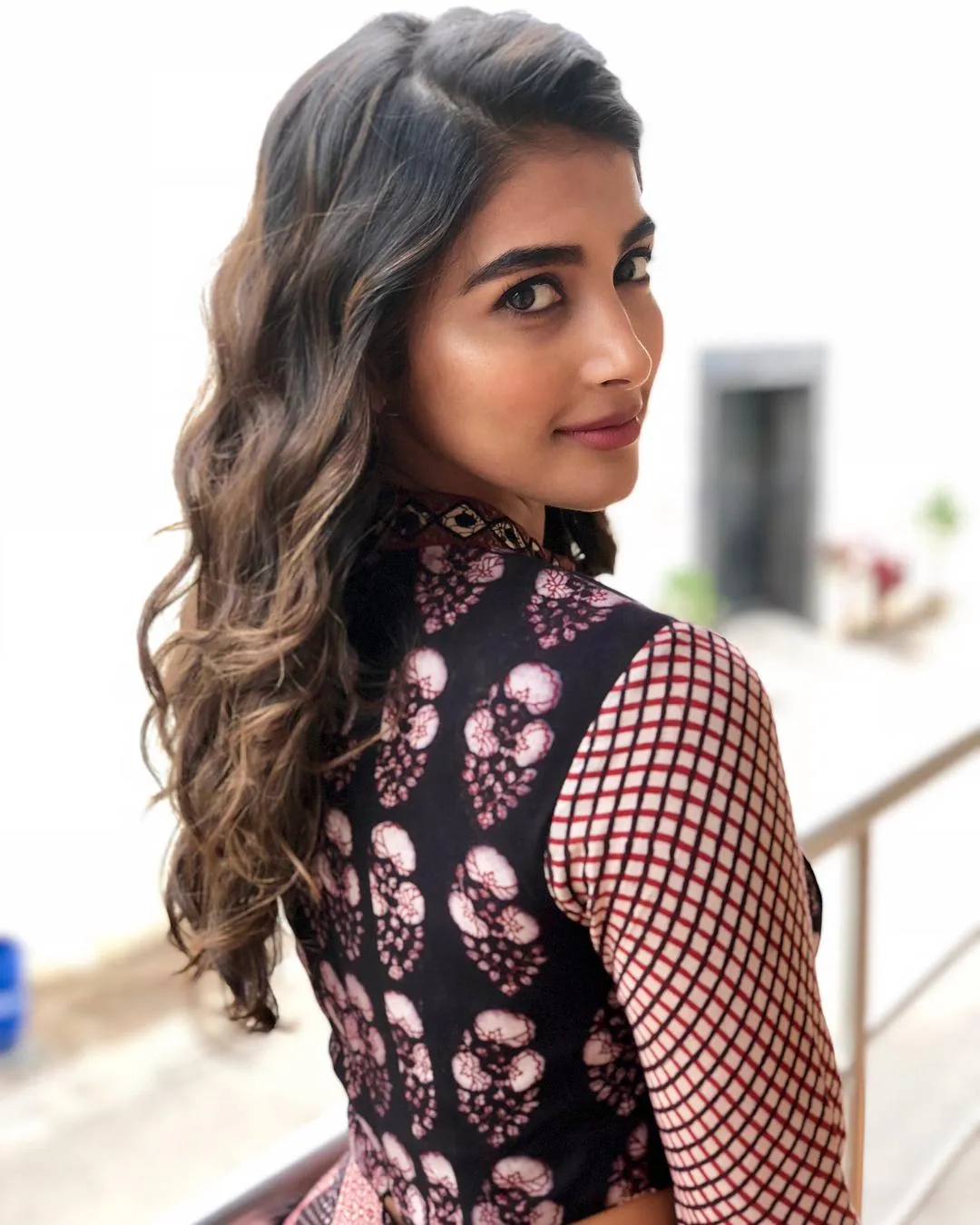 Pooja Hegde Giving a Side Look in a Floral Printed Outfit