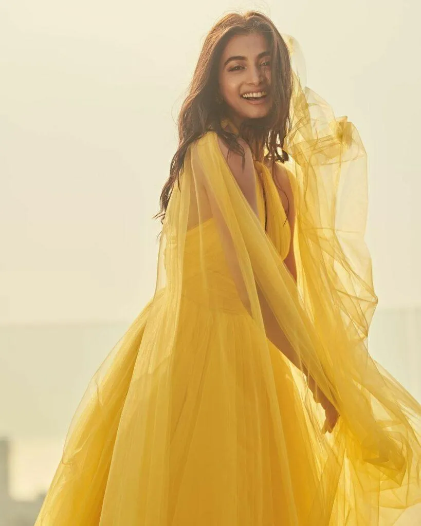 Pooja Hegde Glows in Flowing Yellow Dress Under Soft Light