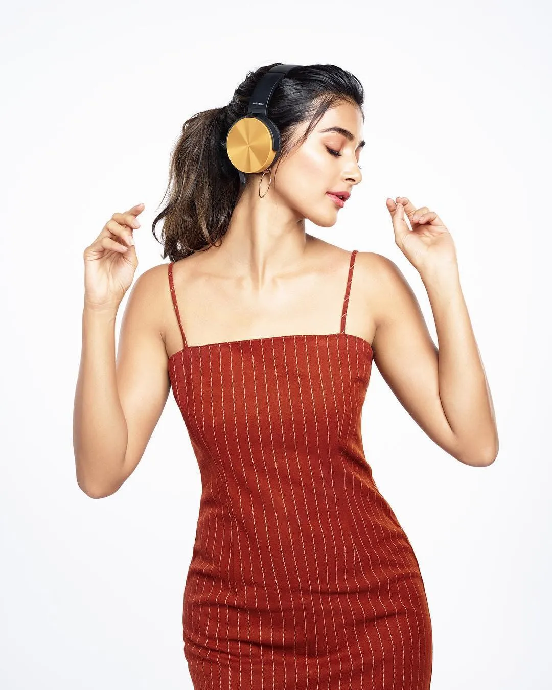 Pooja Hegde in a Strapless Red Dress Pose in White