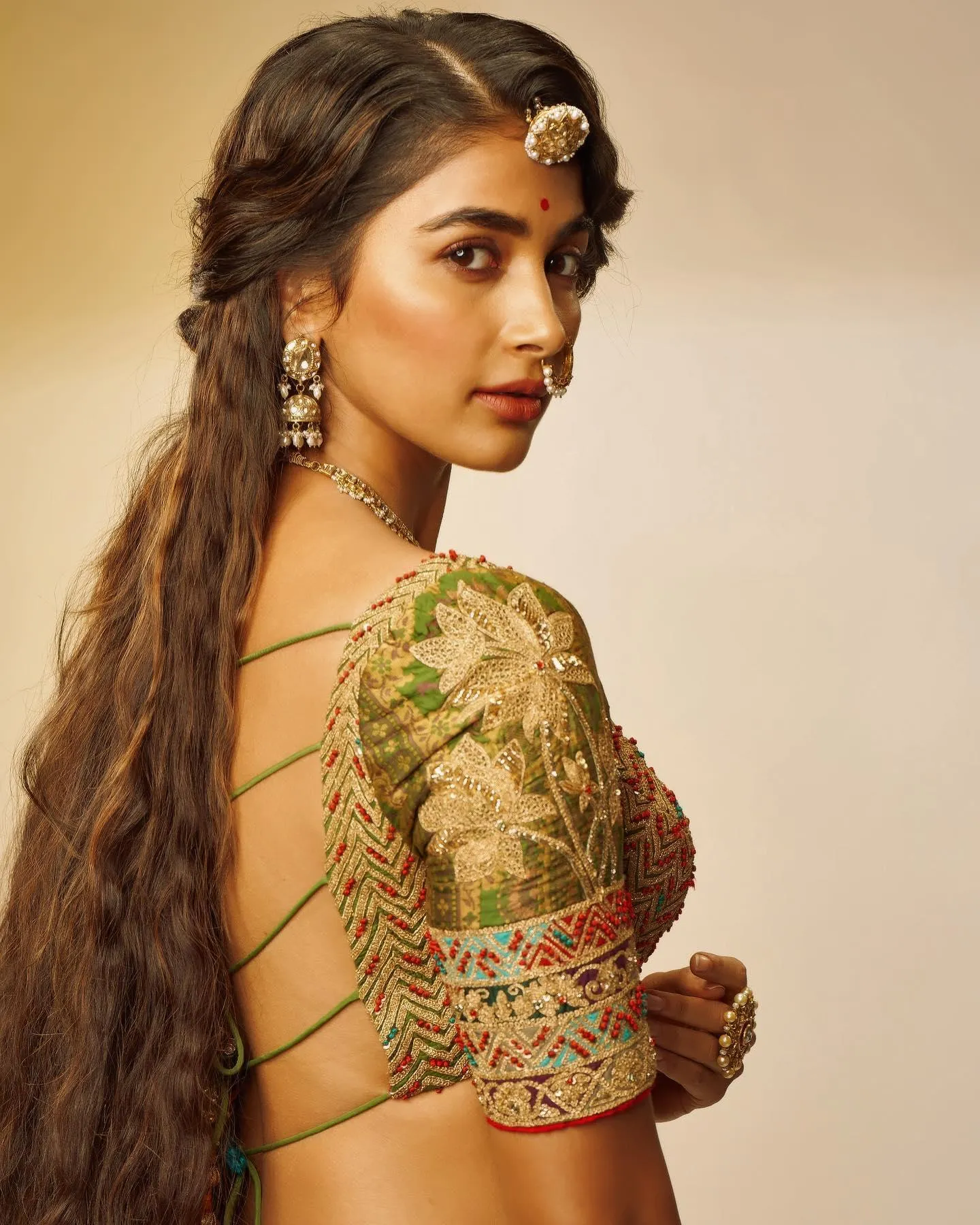 Pooja Hegde in Backless Blouse and Long Braid Look Wallpaper