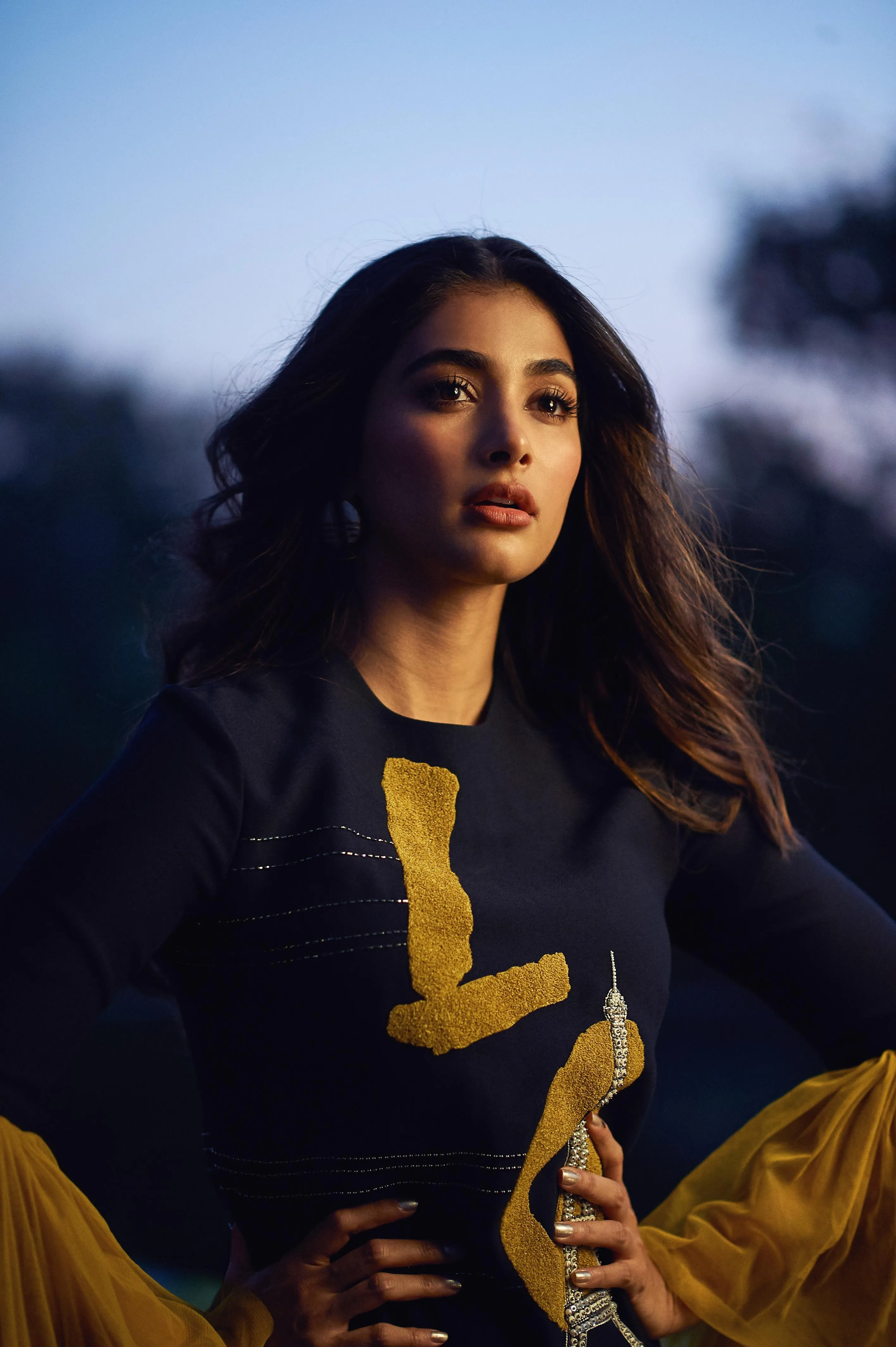 Pooja Hegde in Black and Yellow Dress with Flowing Hair