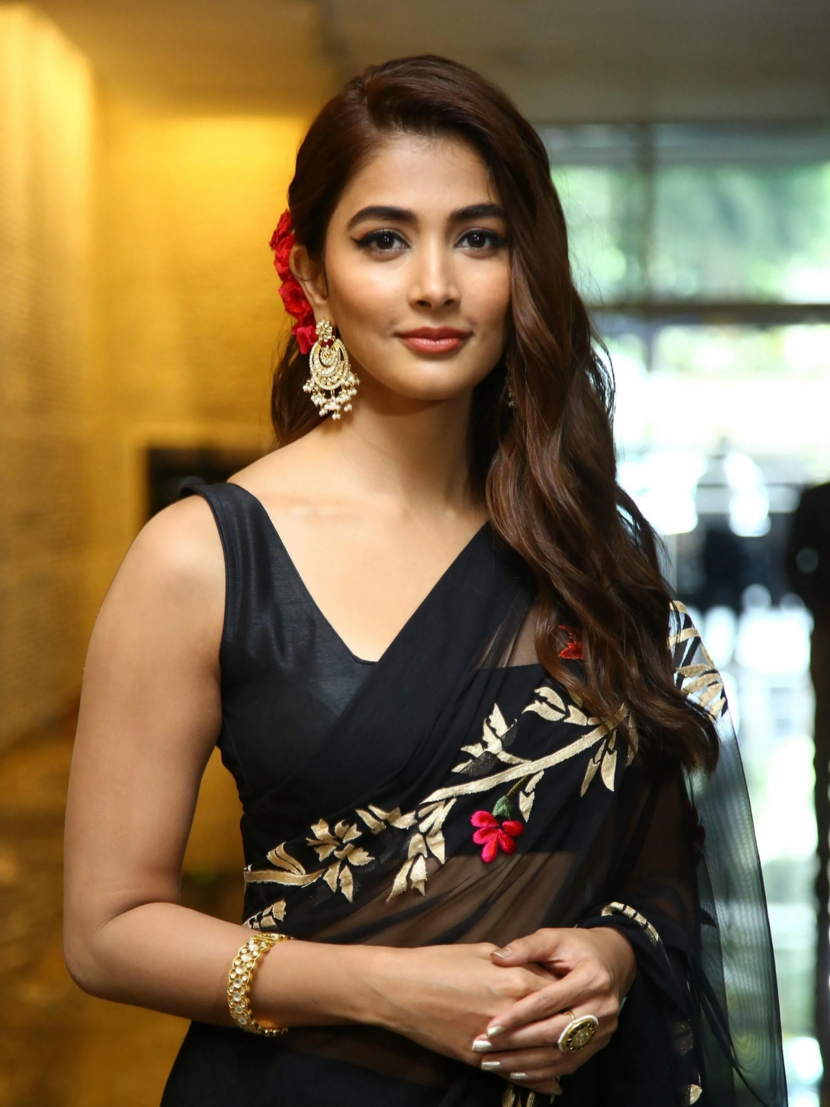 Pooja Hegde in Black Saree with Red Floral Pattern and Earrings