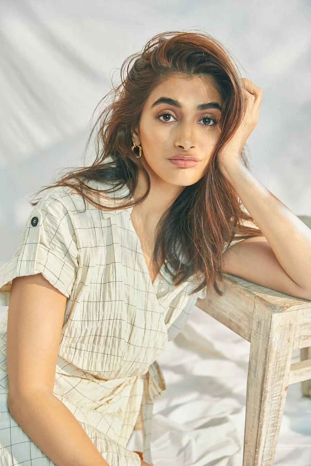 Pooja Hegde in Casual White Shirt Dress with Hand on Face
