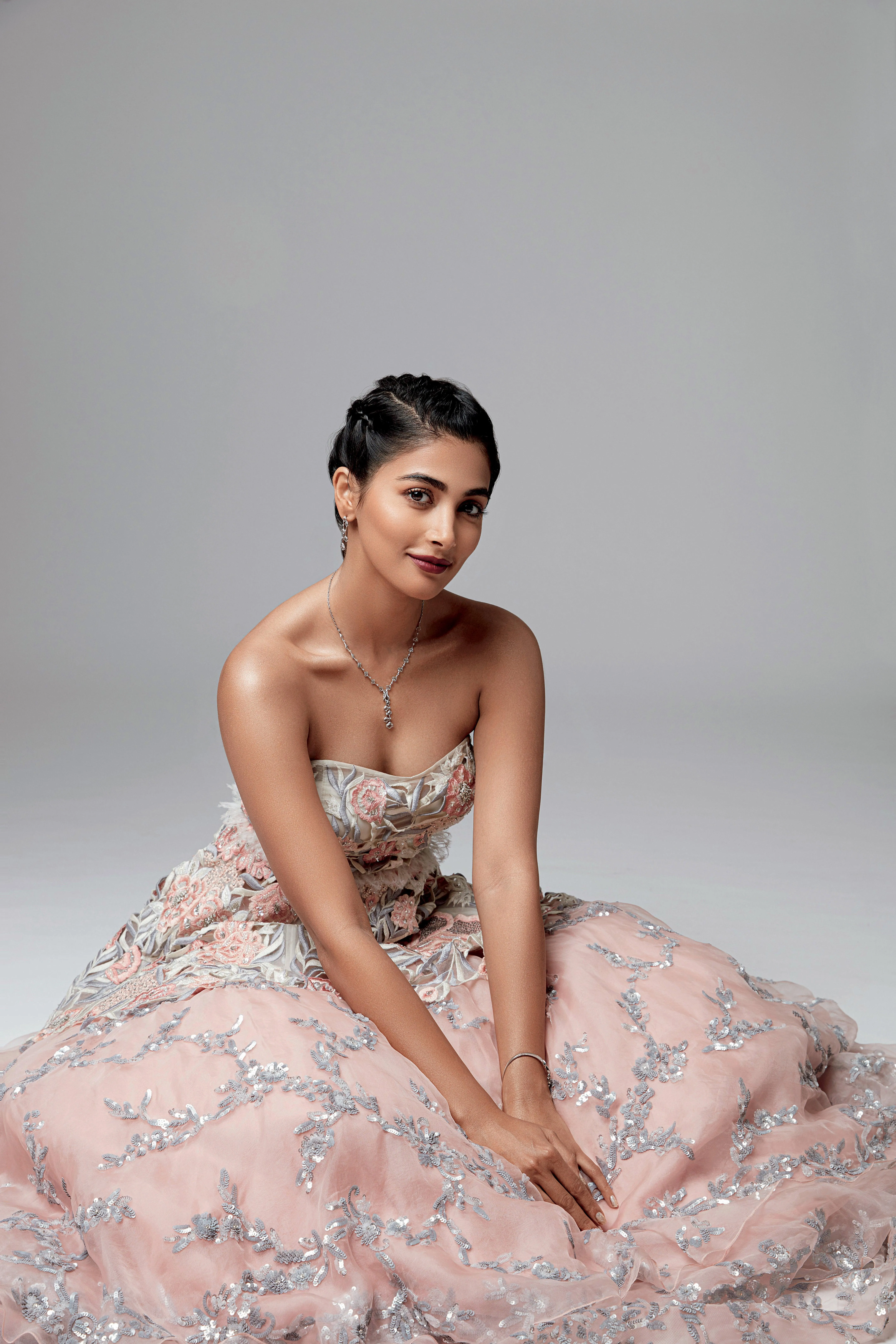 Pooja Hegde in Floral Pastel Gown Seated on Studio Floor