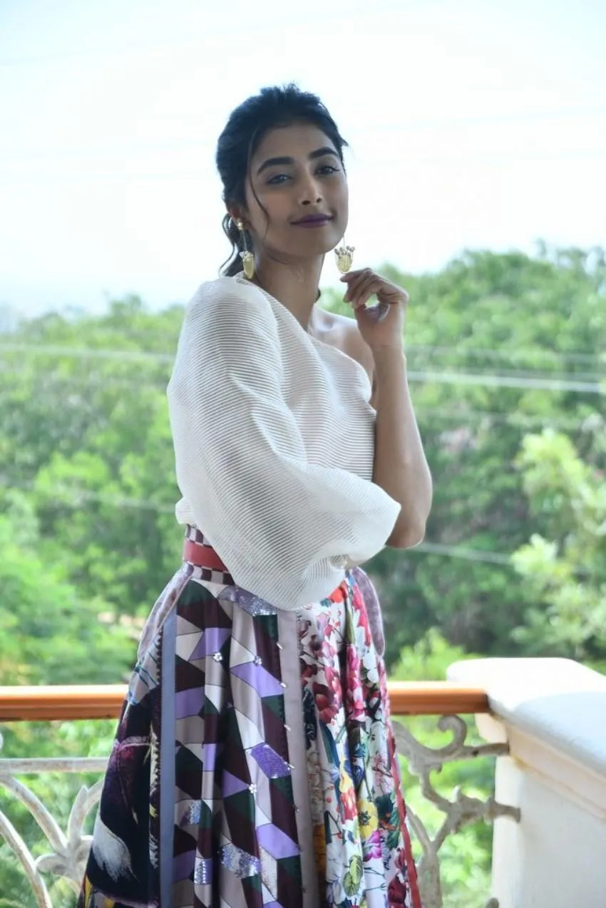 Pooja Hegde in Floral Skirt and White Top on Balcony