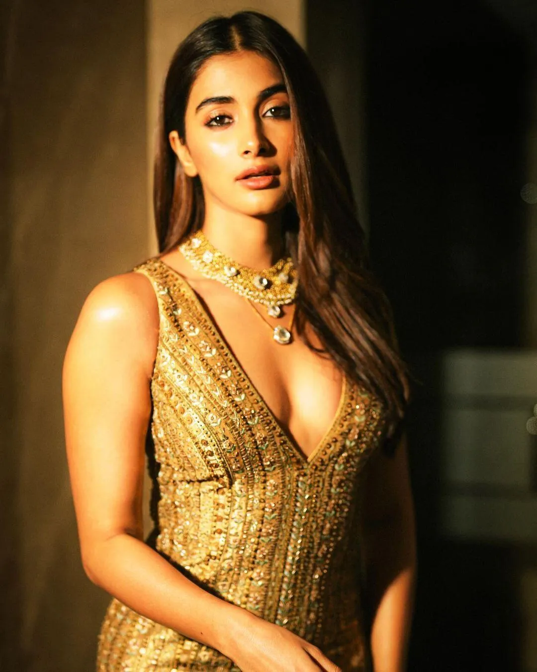 Pooja Hegde in Golden Gown with Layered Necklace Look